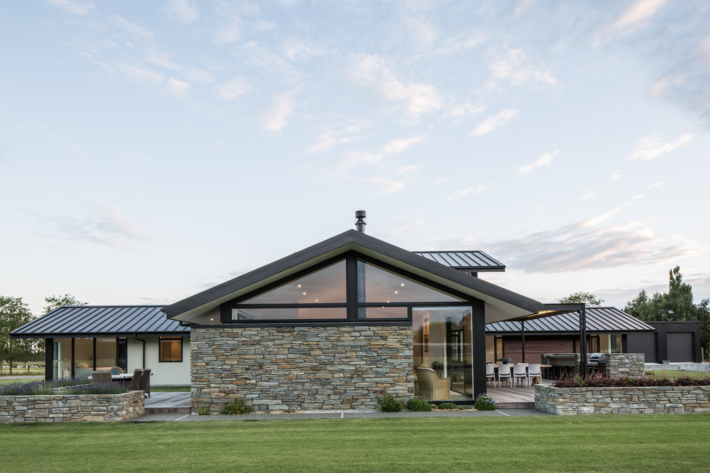 Modern architectural home with outdoor living area built to last by Millar Construction
