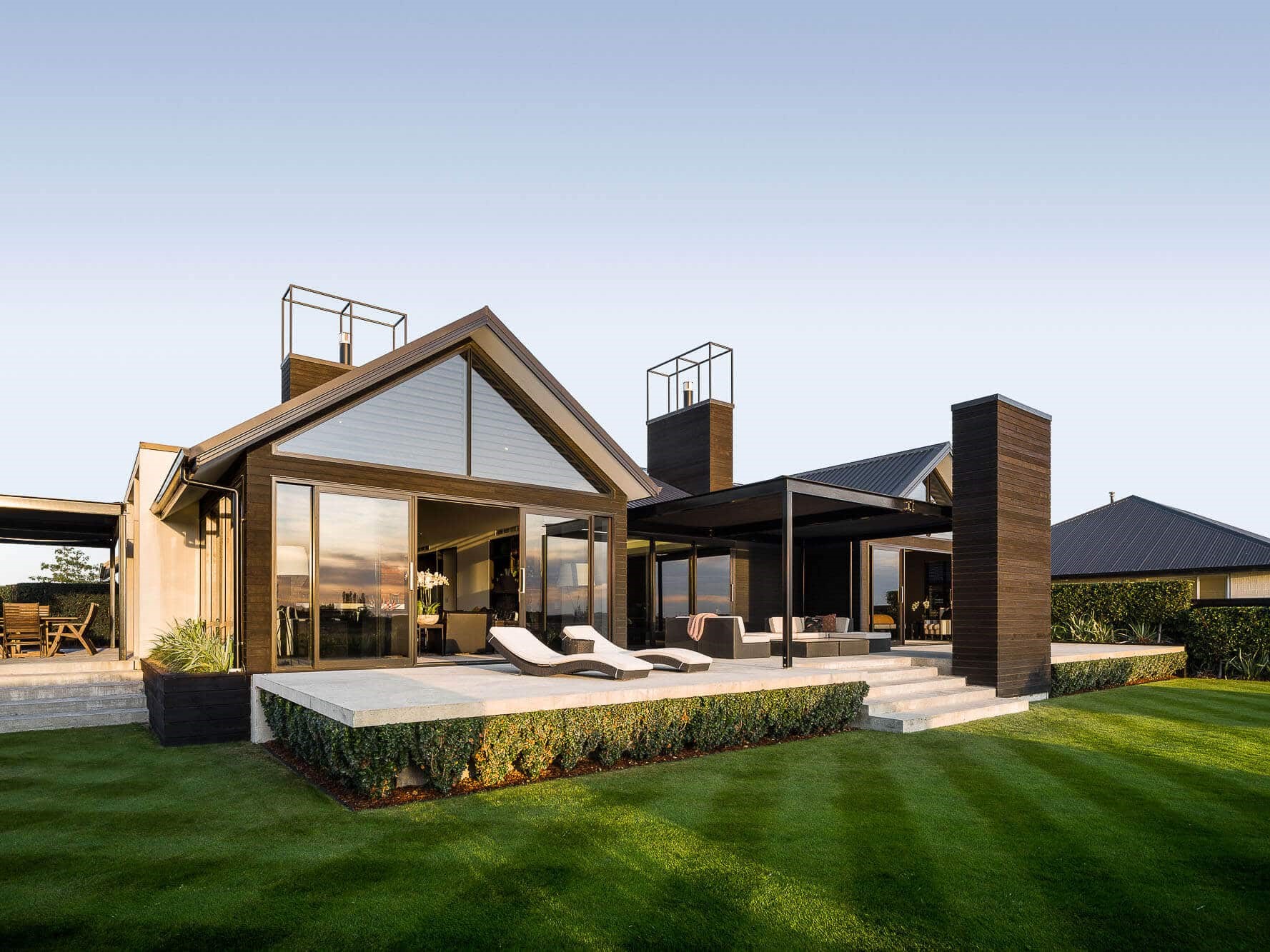 Modern architectural home with outdoor living area built to last by Millar Construction
