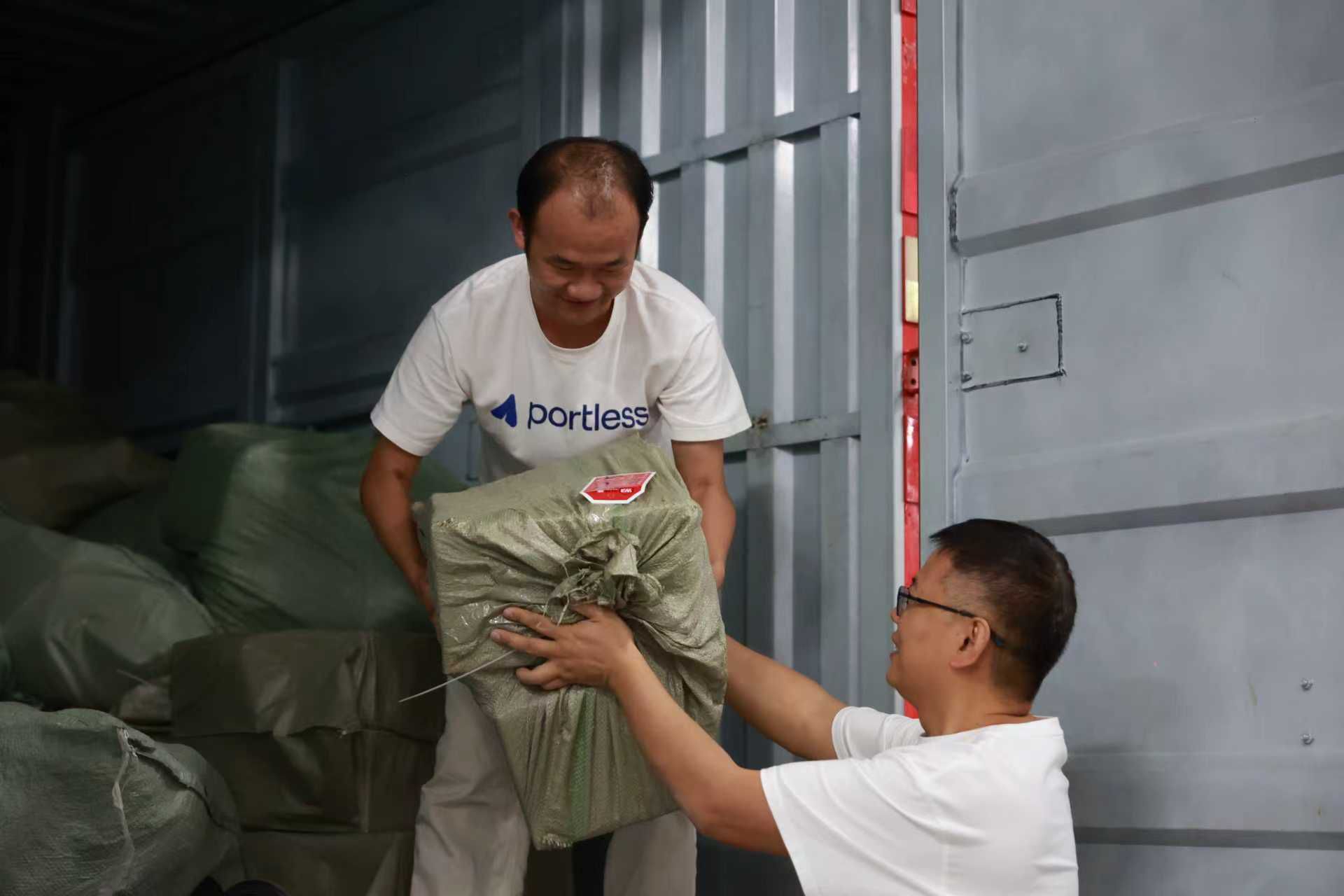 Portless outbound team loading sorted packages for last-mile carriers