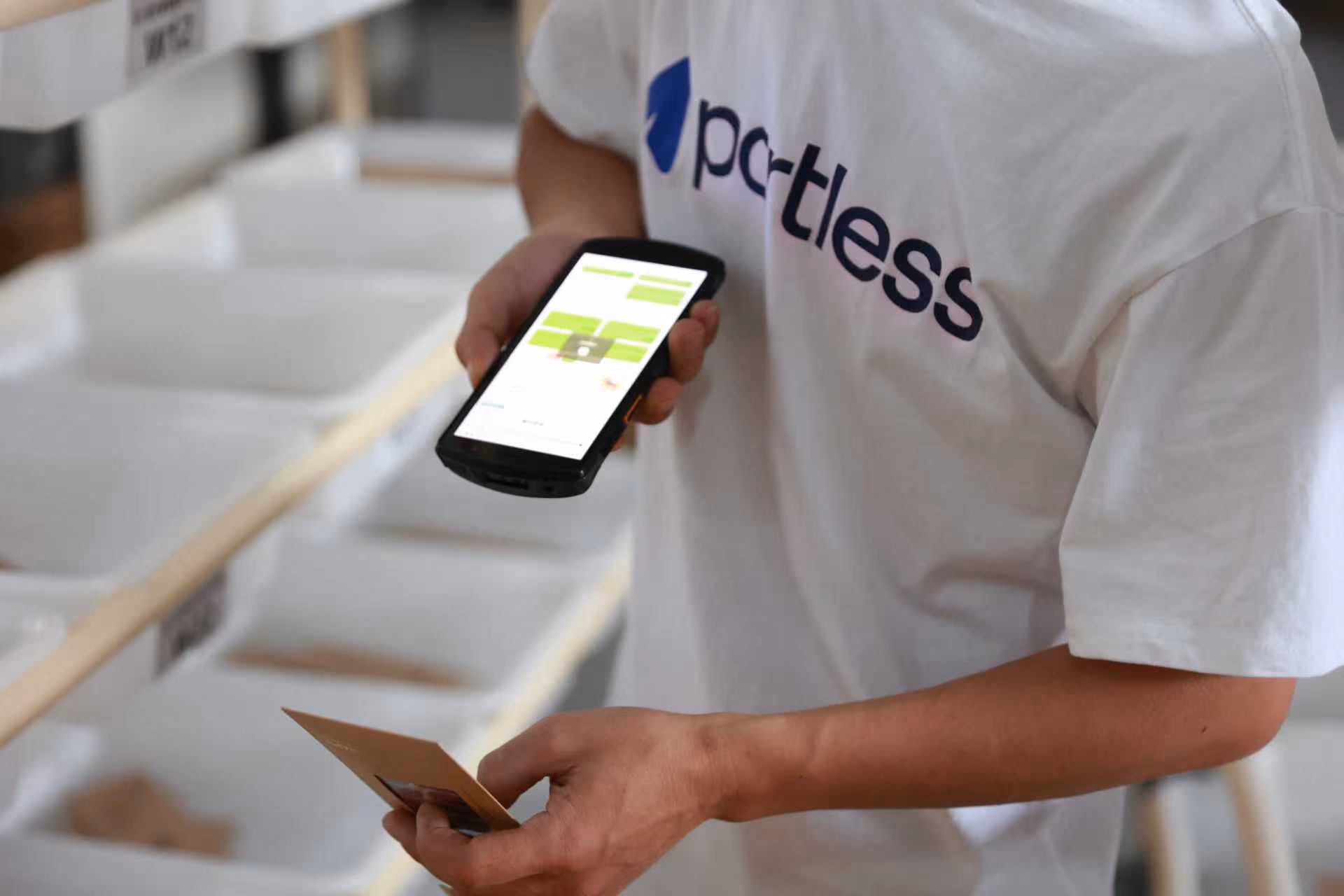 Picker scanning items in the Portless picking area