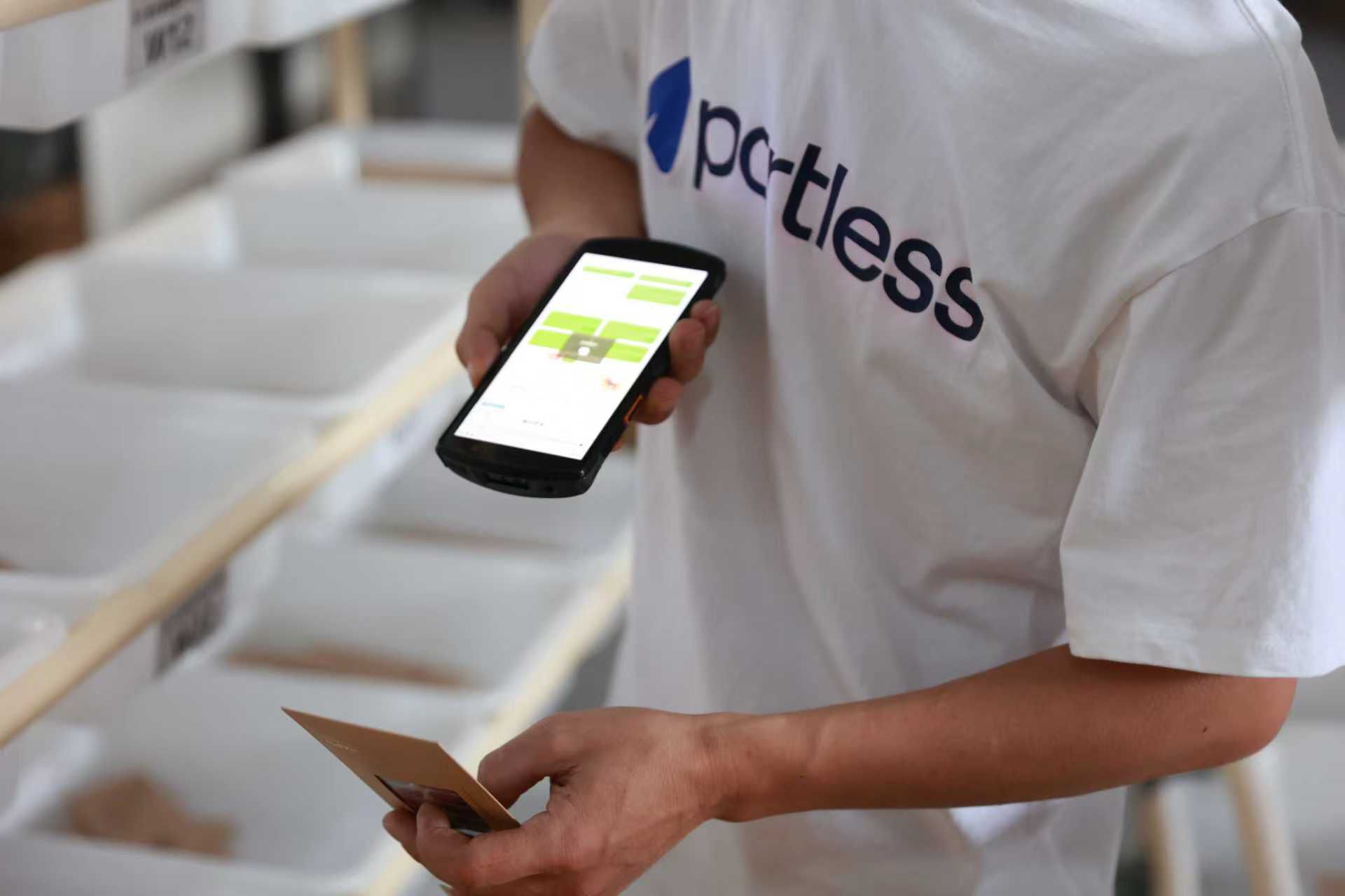Picker scanning items in the Portless picking area