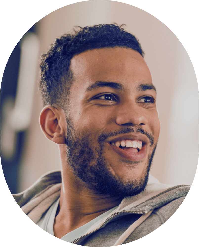 Man smiling and looking to the right