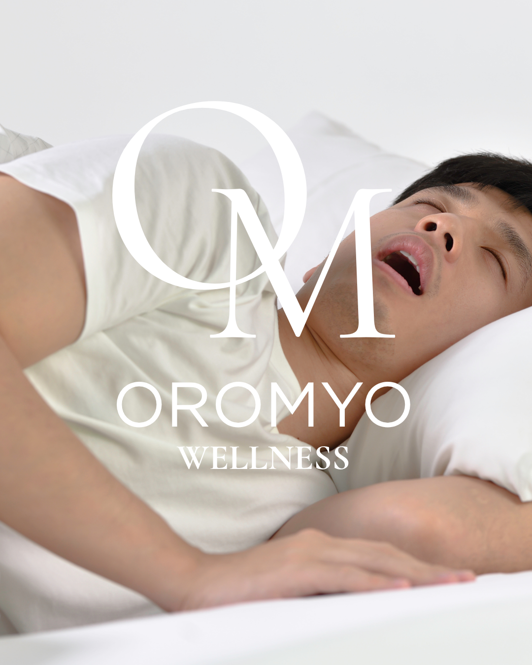 Man sleeping with mouth open, Oromyo wellness logo overlay