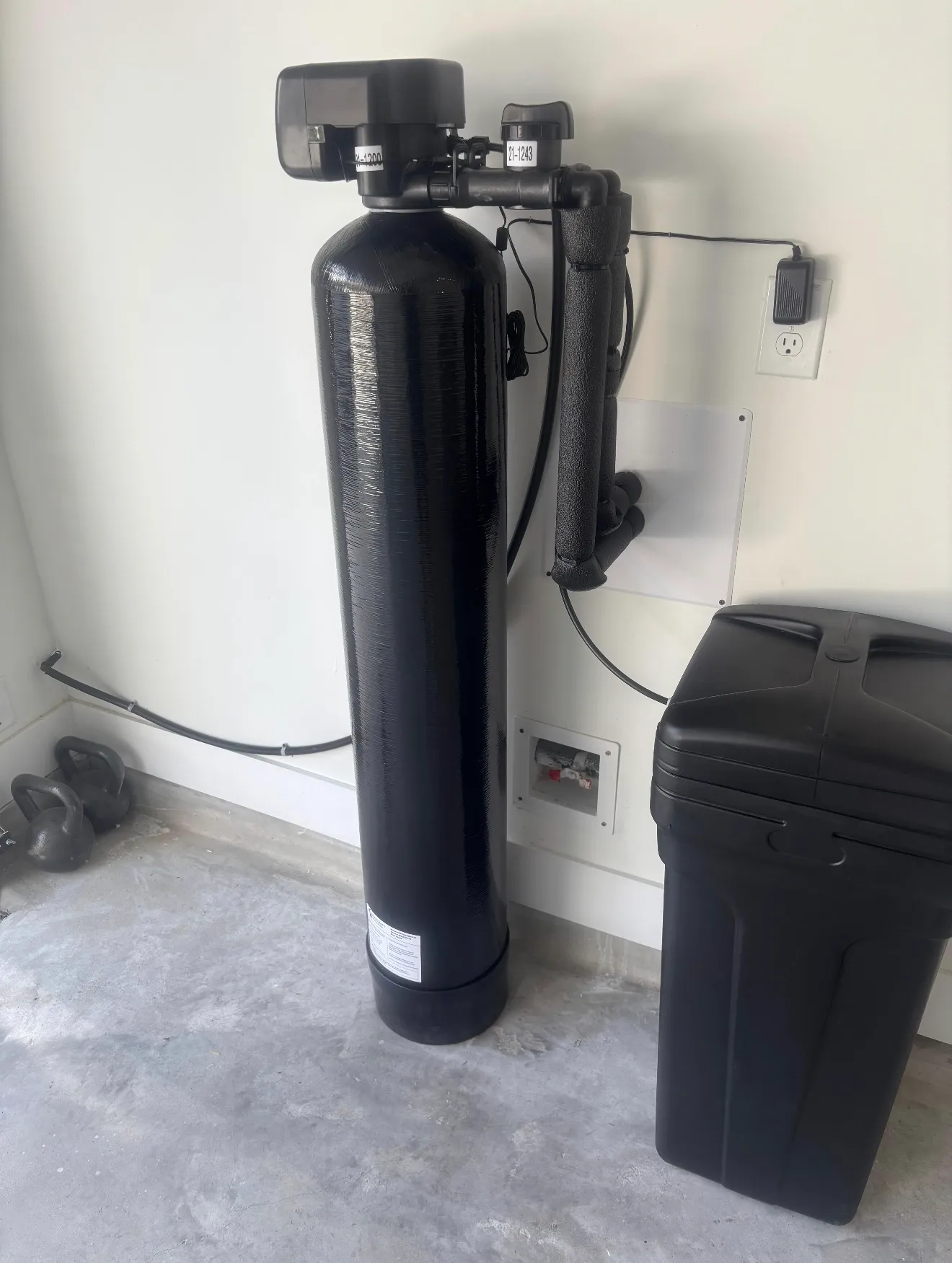 Whole-home water softener install in a garage