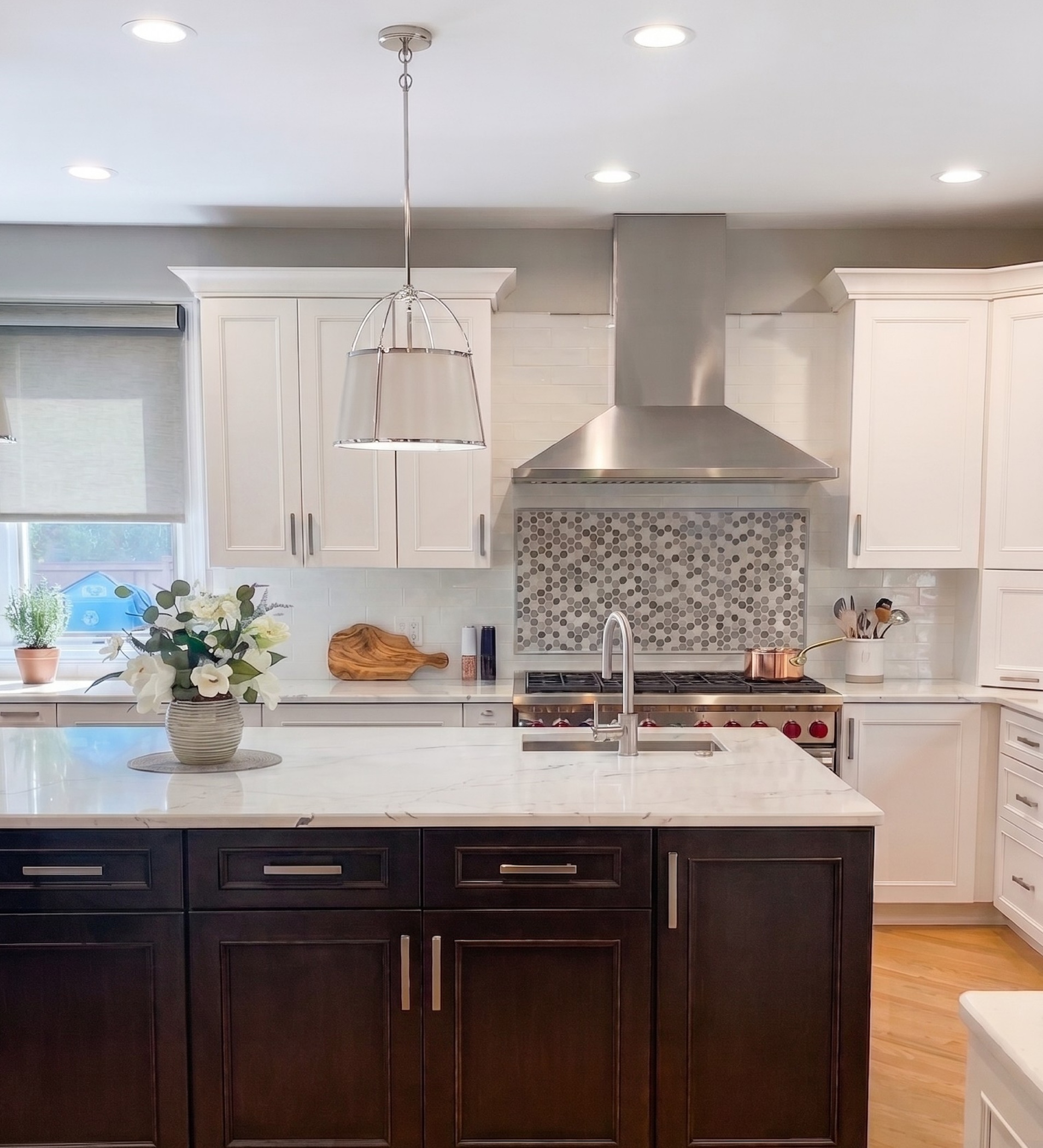 Espresso wood tone traditional kitchen with white stone countertops by 1st Design Studio