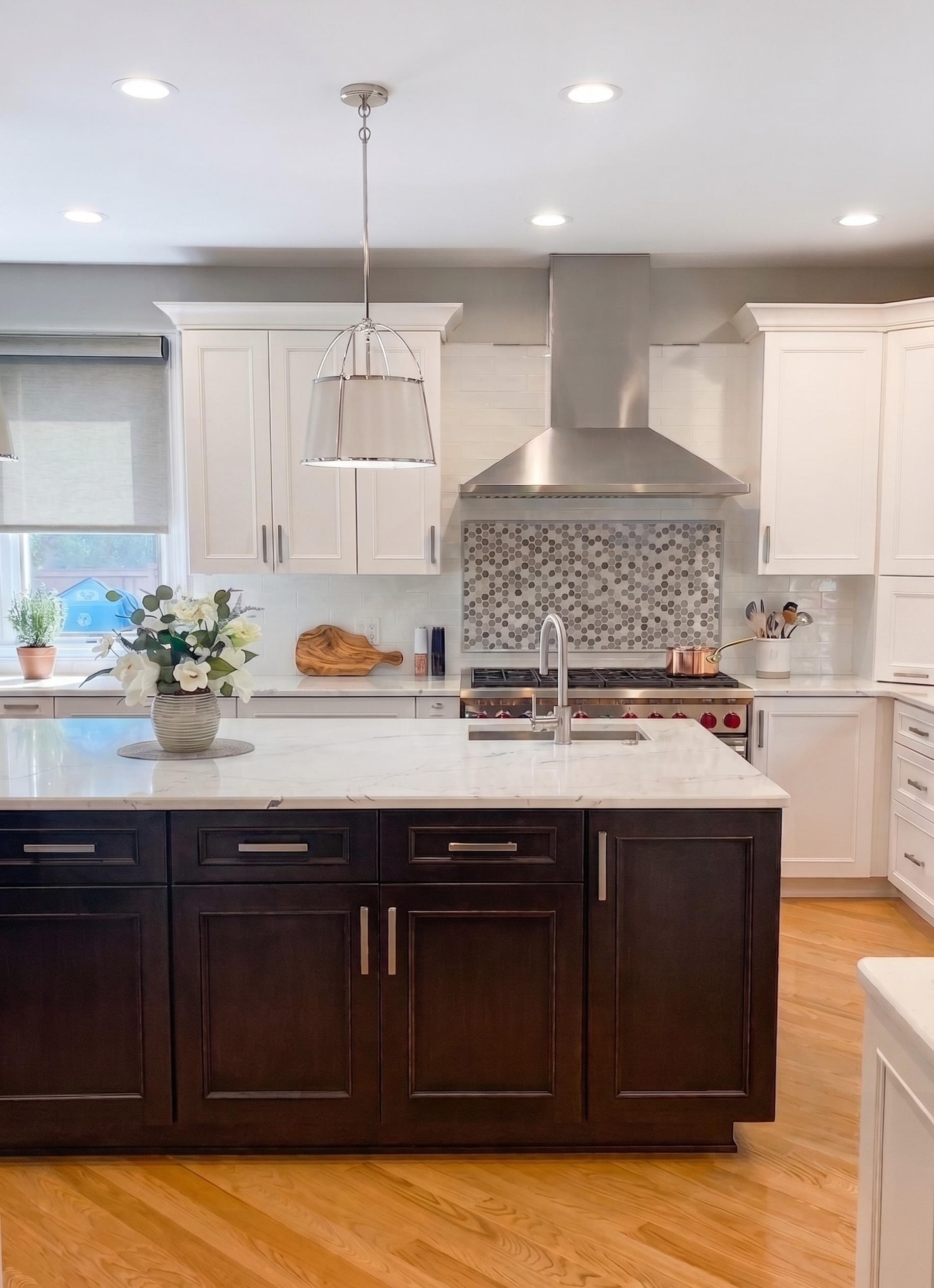 Espresso wood tone traditional kitchen with white stone countertops by 1st Design Studio