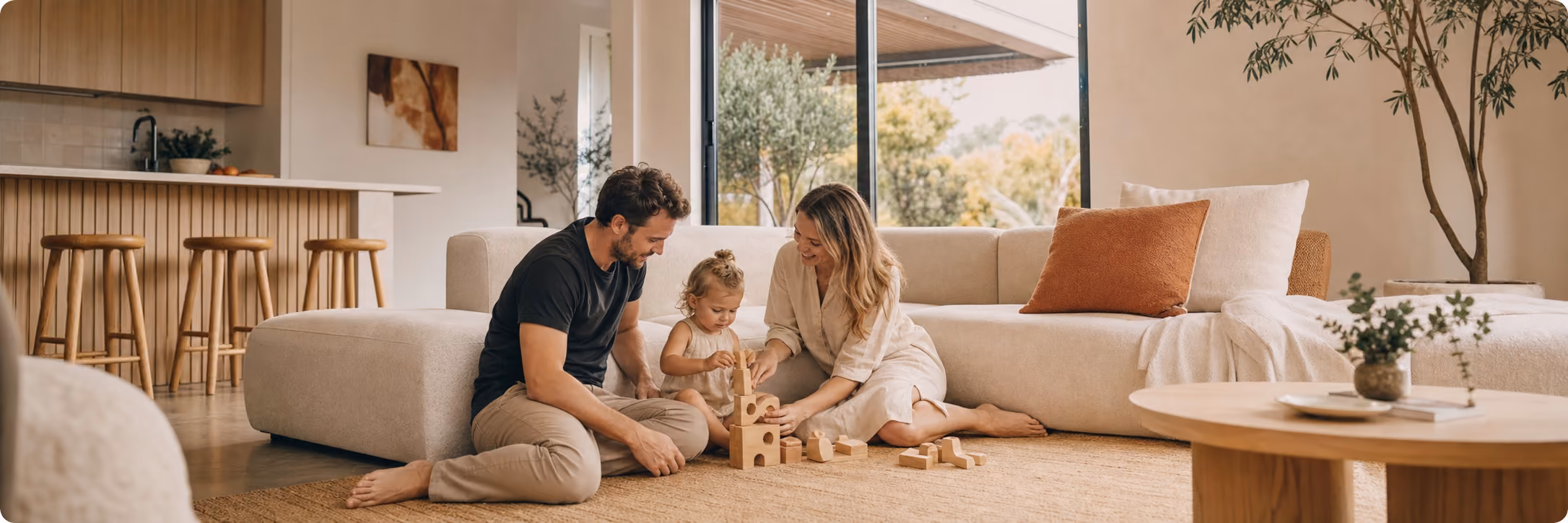 A family standing together in front of their home