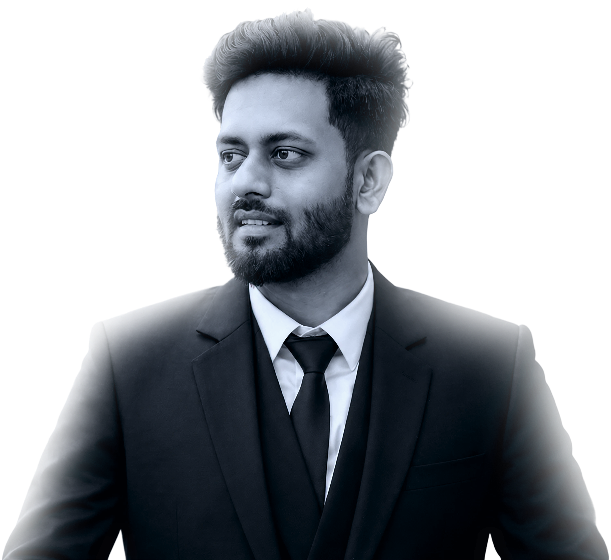 Man with beard wearing a black suit, white shirt, and black tie looking to his left.