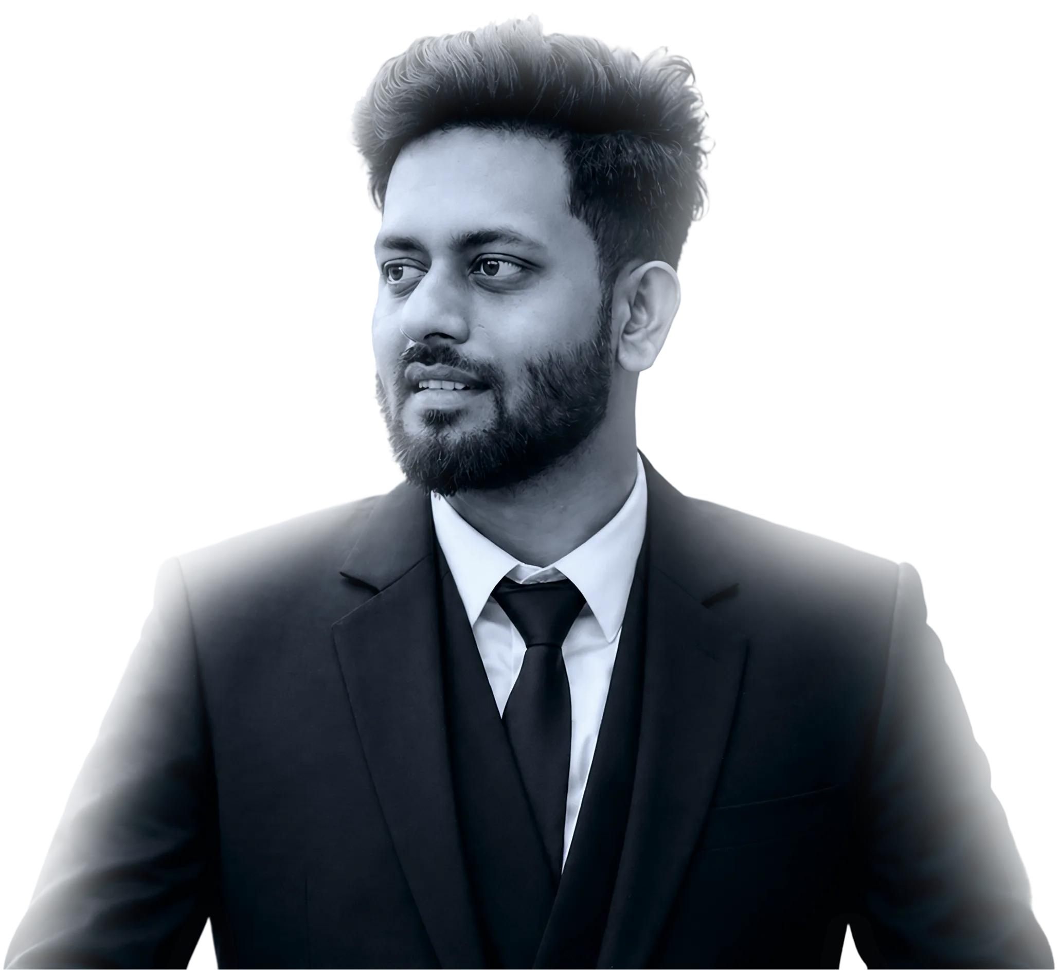 Man with beard wearing a black suit, white shirt, and black tie looking to his left.