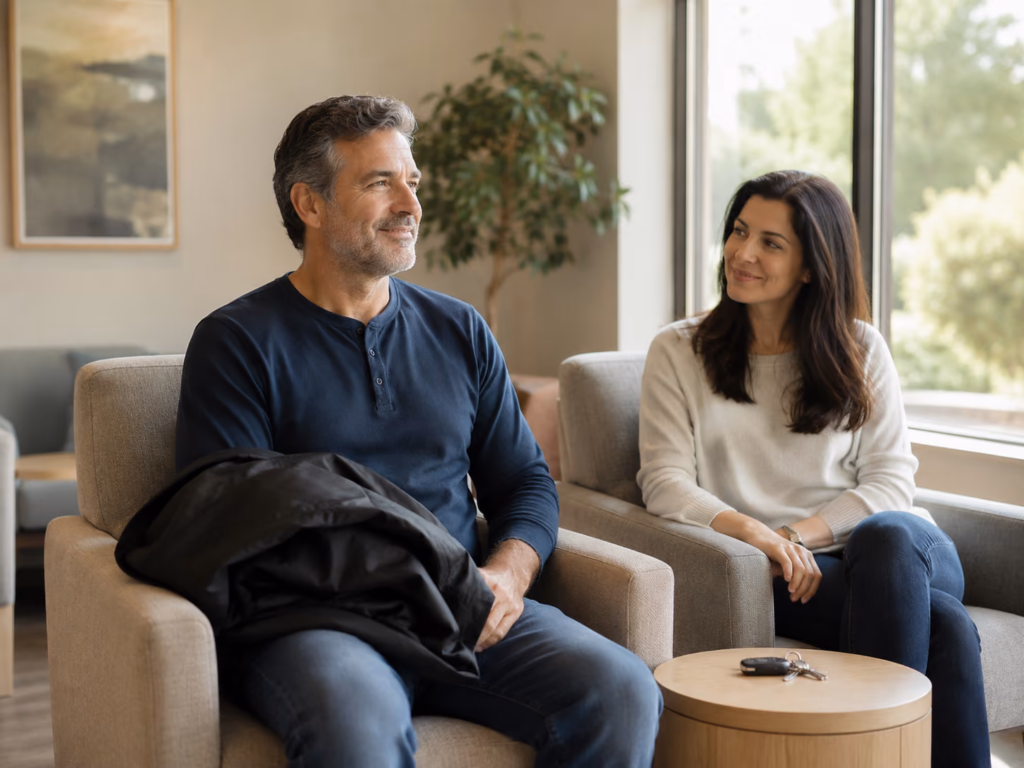 Patient and companion relaxing together before an in-office IV sedation appointment