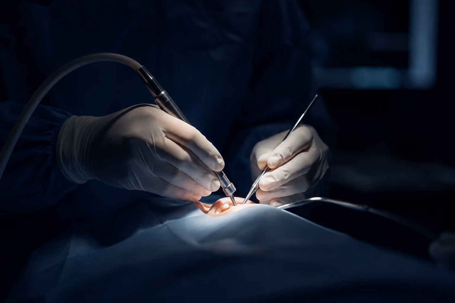 Board-certified oral surgeon placing dental implants under in-house IV sedation
