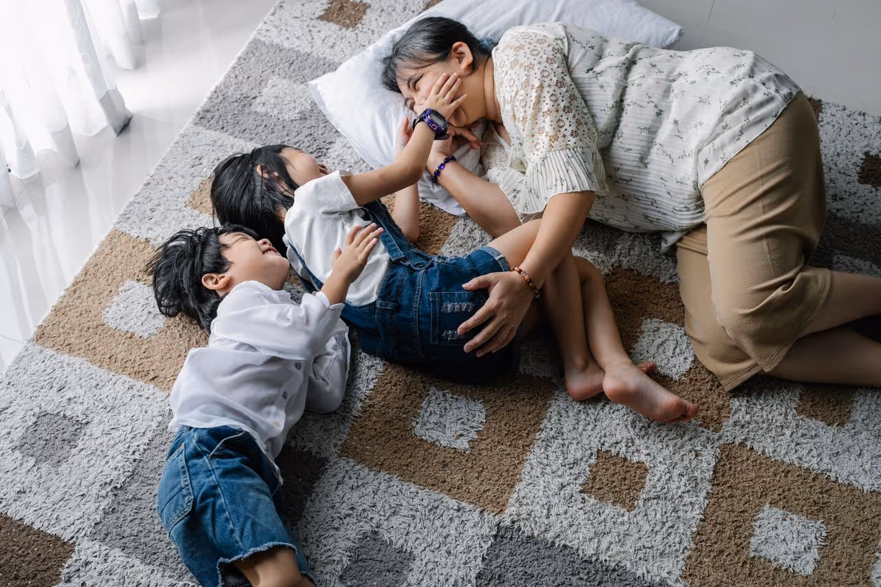 Family playing on the ground