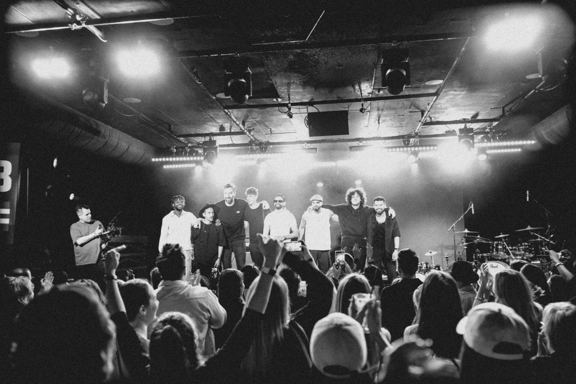Kállay Saunders and band, black and white concert photograph