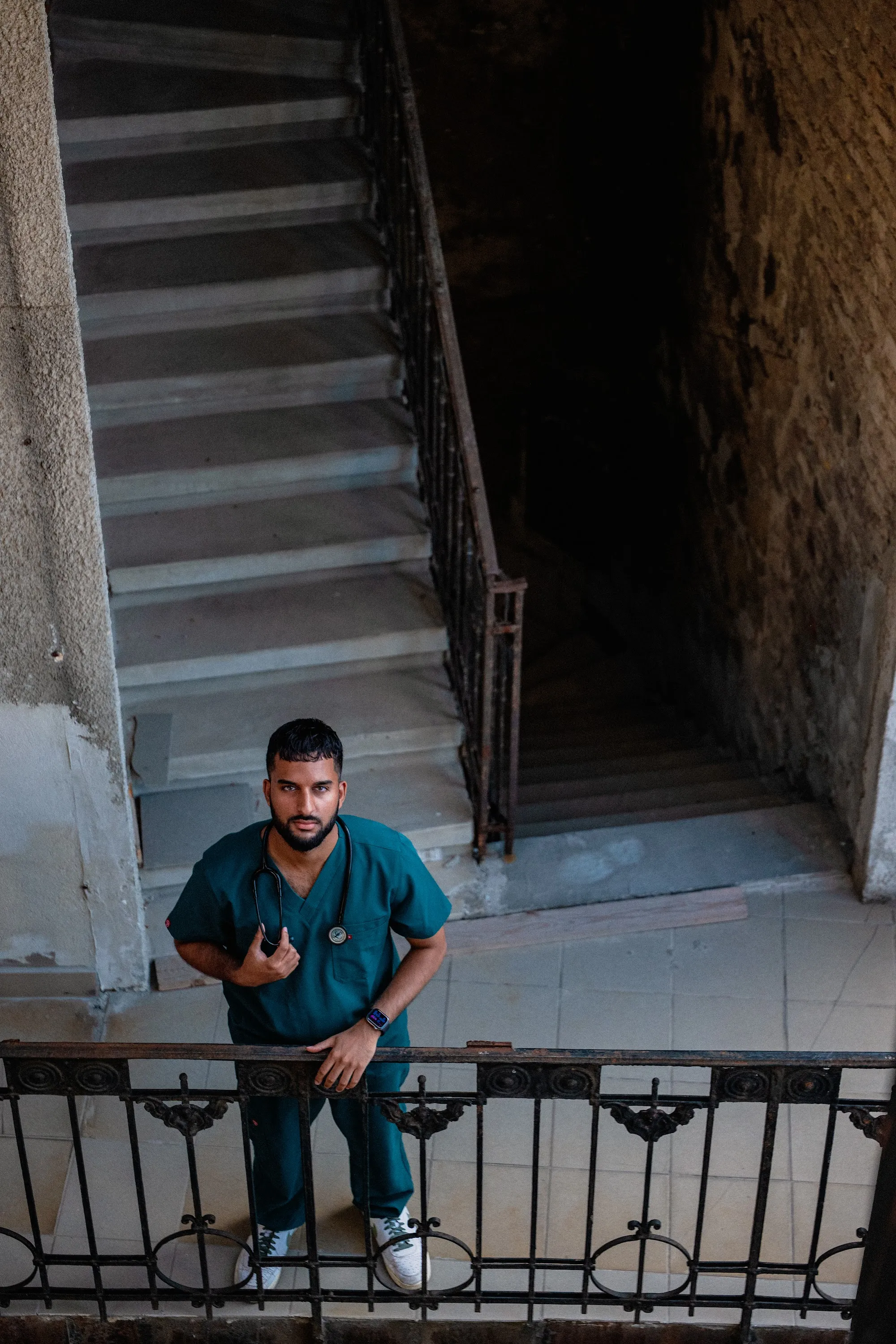 Model Zoubi seated on a staircase, portrait by GROOVE Media