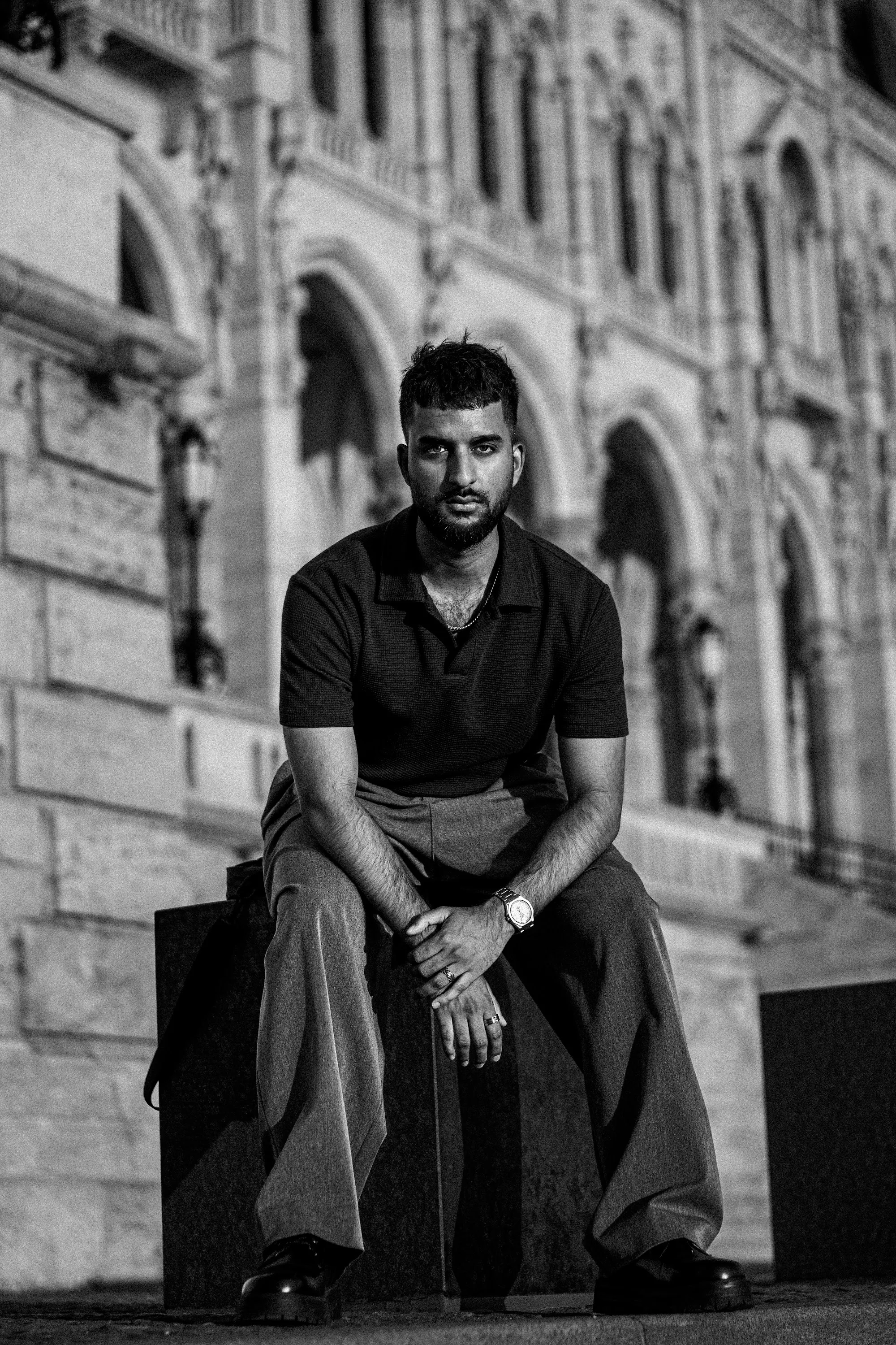 Model Zoubi seated beneath Gothic arches at the Hungarian Parliament, Parliament Gold editorial by GROOVE Media
