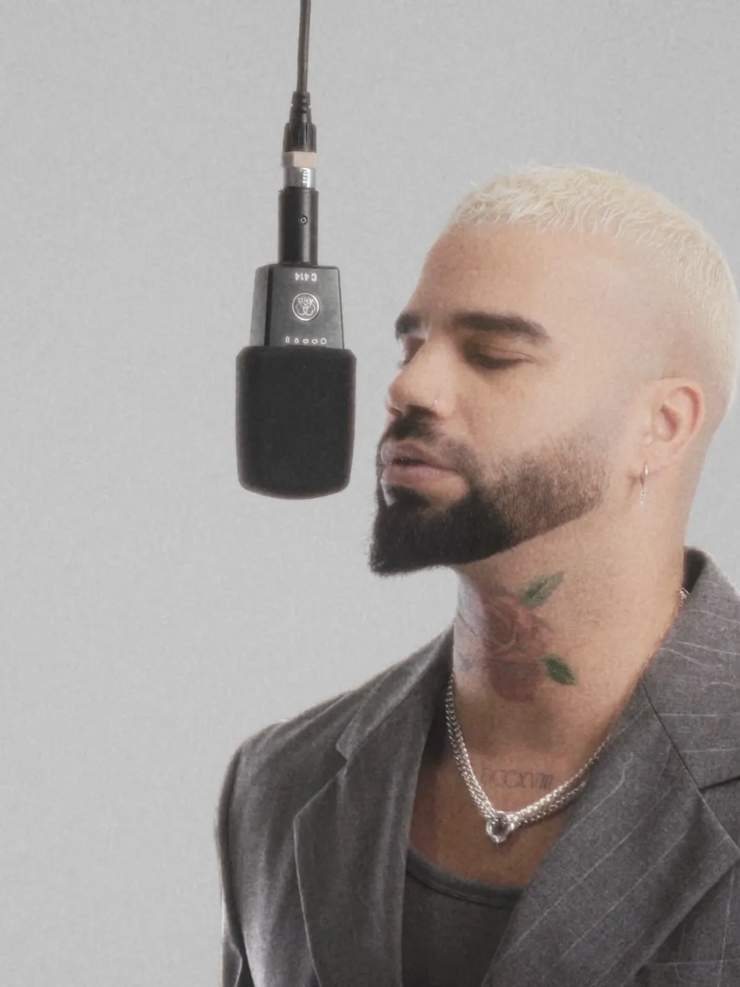 Kállay Saunders singing at a studio microphone, artist portrait by GROOVE Media