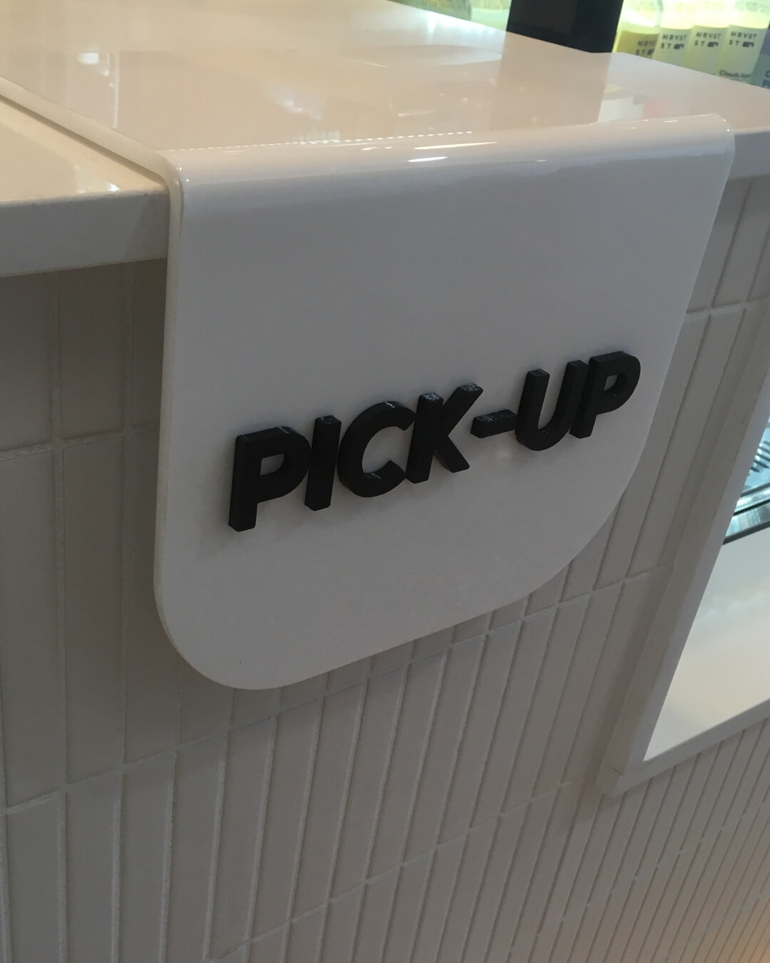 Custom acrylic sign 'pick-up' for hospitality space