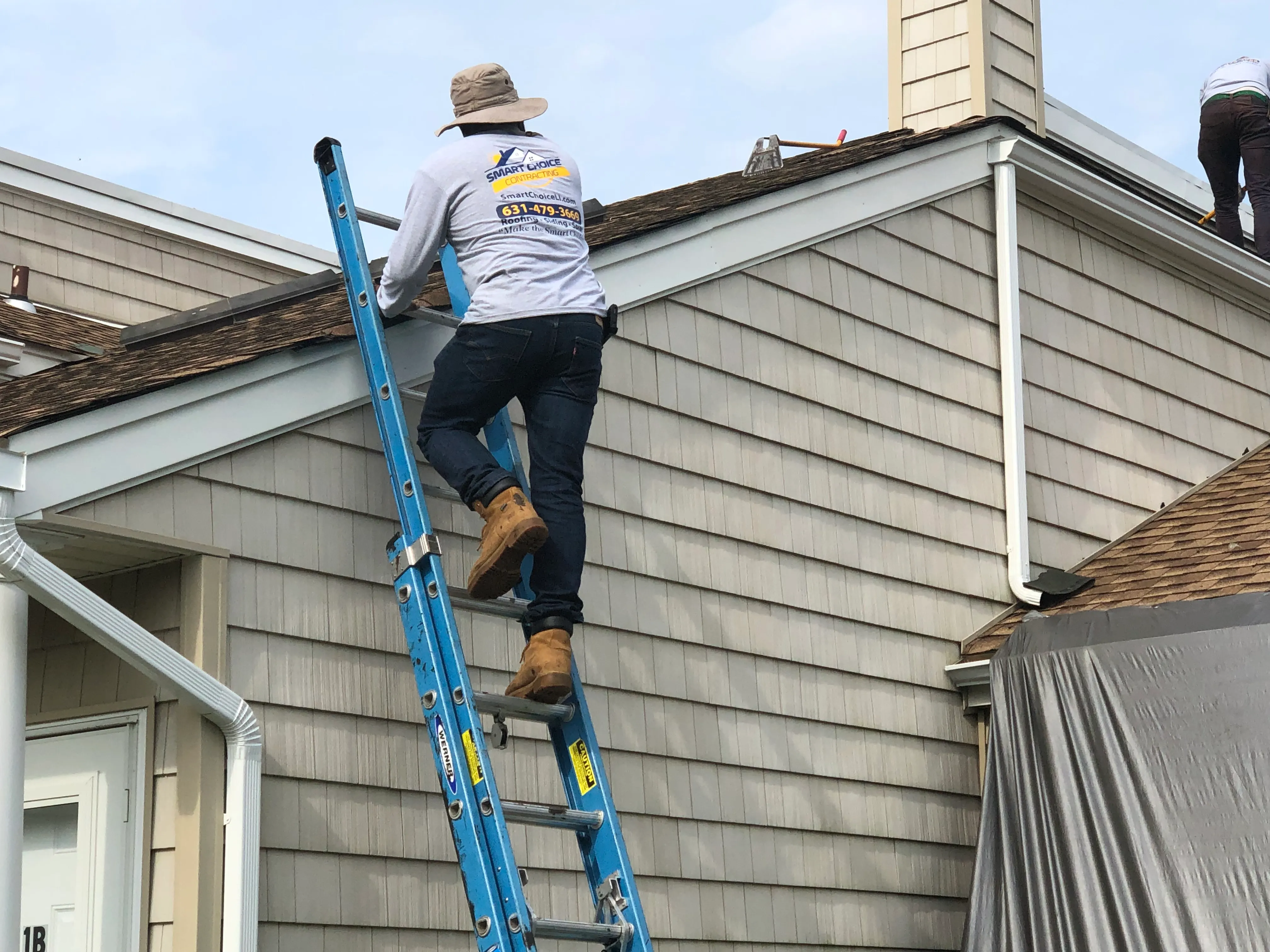 Smart Choice Contracting crew replacing a residential roof in Melville, Long Island, NY