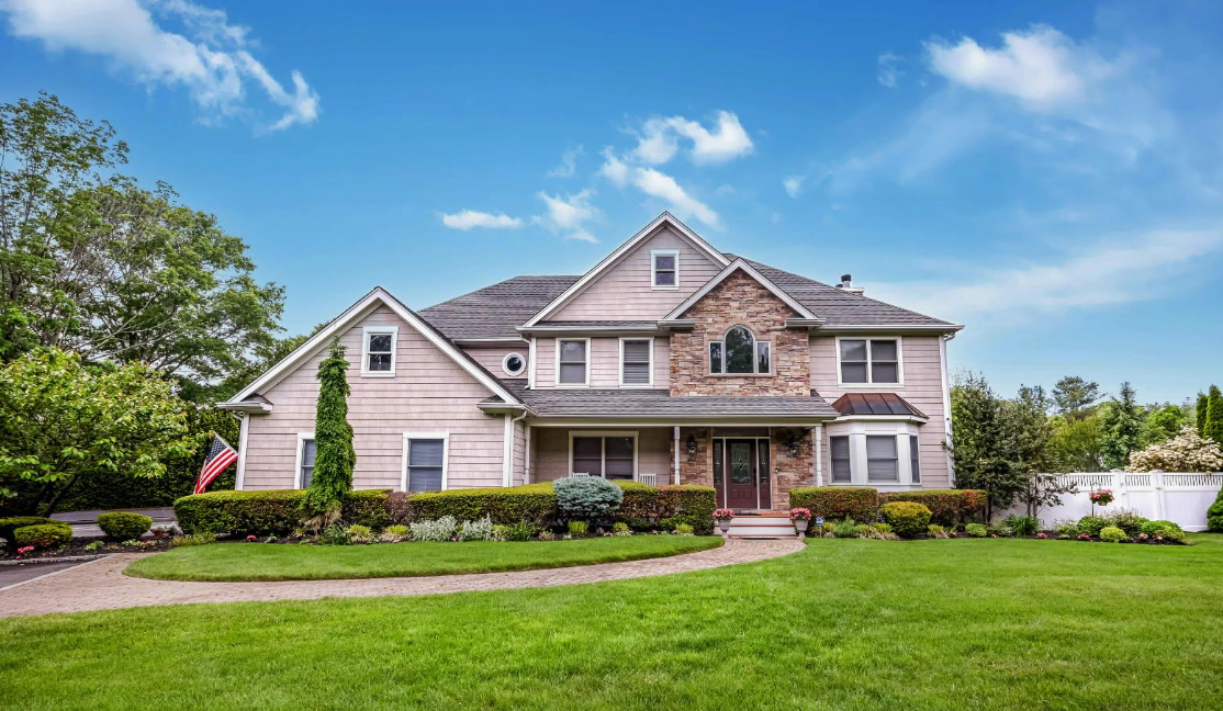 Smart Choice Contracting crew replacing a residential roof in Melville, Long Island, NY
