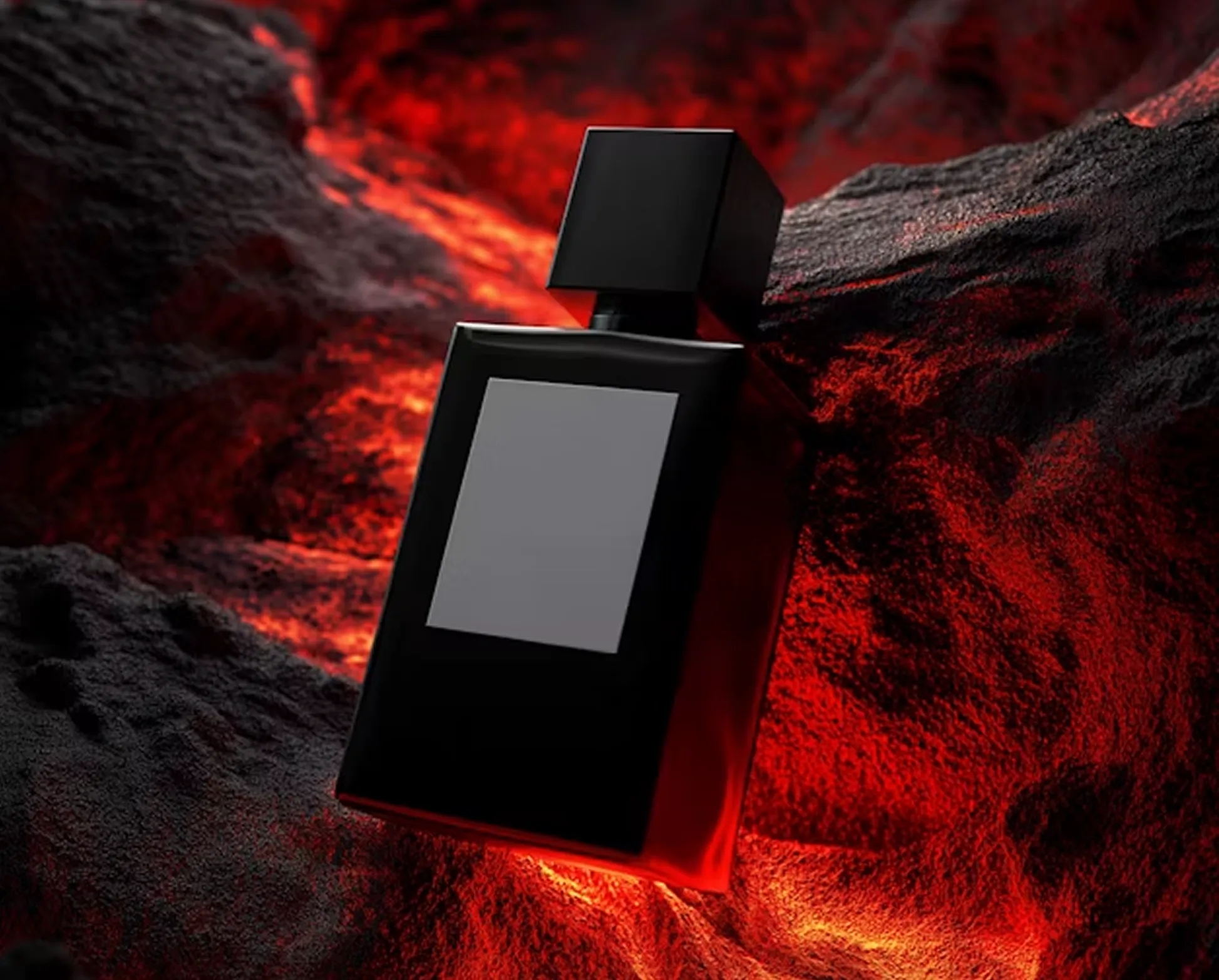 Black perfume bottle with blank label resting on glowing volcanic rocks with red lava light.