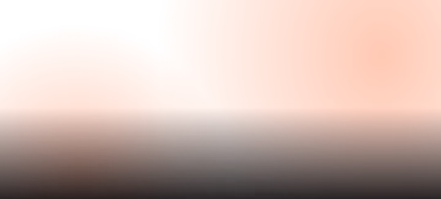 Abstract image with bright orange shapes and a dark gradient below.