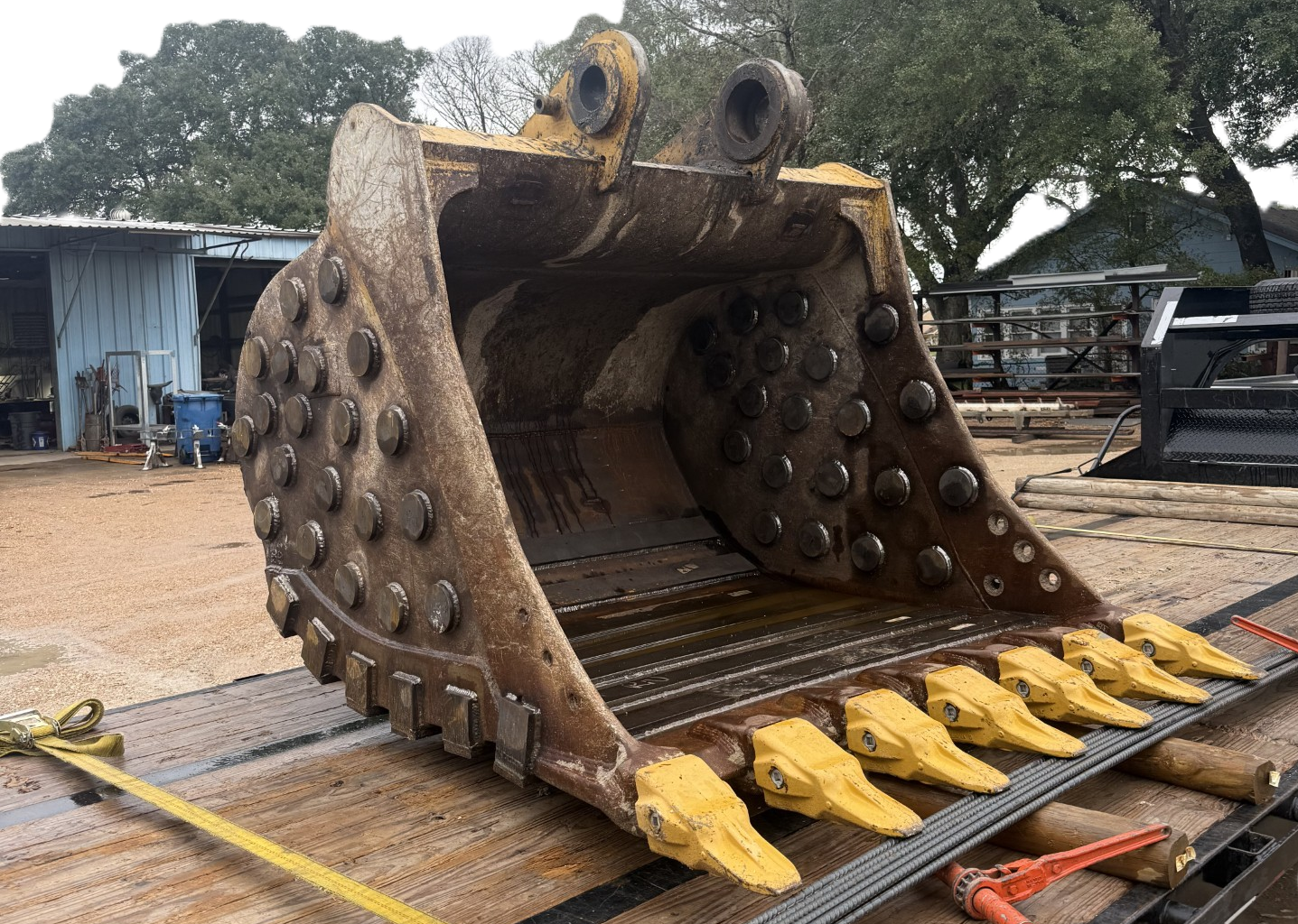 Refurbished heavy equipment bucket with new wear components installed by Hartman Welding & Fabrication.