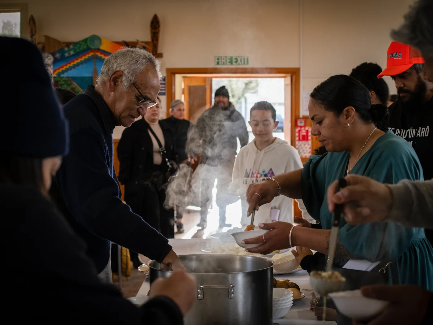 Kai being served to manuhiri in the wharekai