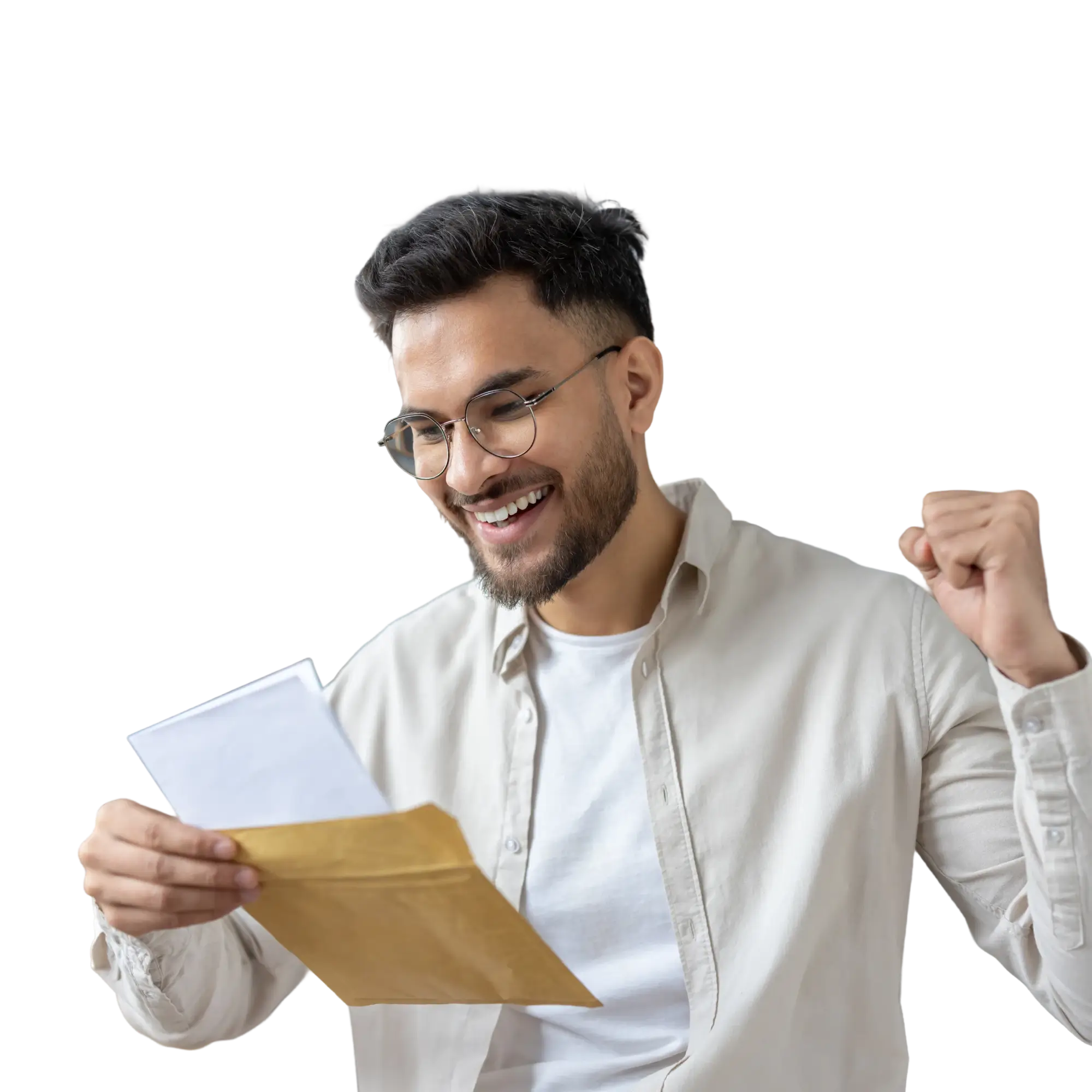 Smiling man with glasses reading a letter from a brown envelope, showing excitement with a raised fist.