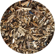 Close-up of natural wood mulch chips in a circular frame.