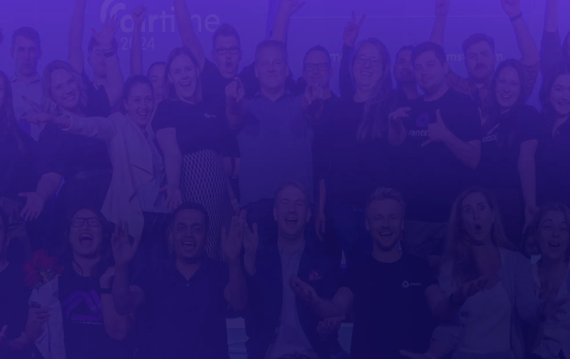 EventsAir team cheering and celebrating together on stage at AirTime 2024