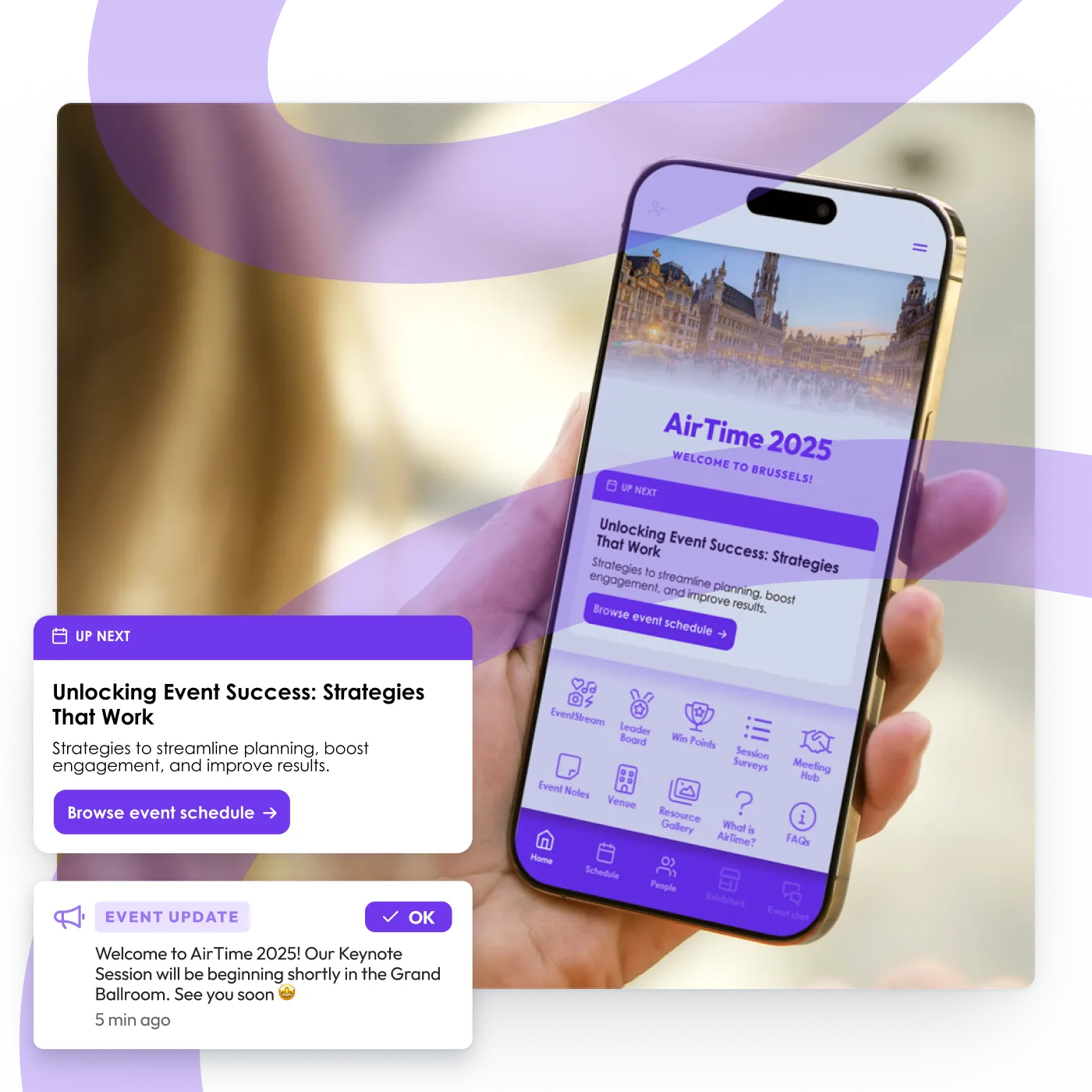 Hand holding a phone showing a custom AirTime 2025 event app with schedule and event update alerts