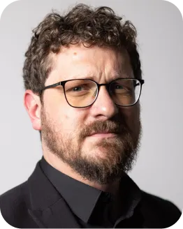 Portrait of Michael Lockett with a beard and glasses
