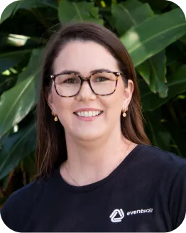 Portrait of Renee Elliot wearing glasses and an EventsAir branded shirt