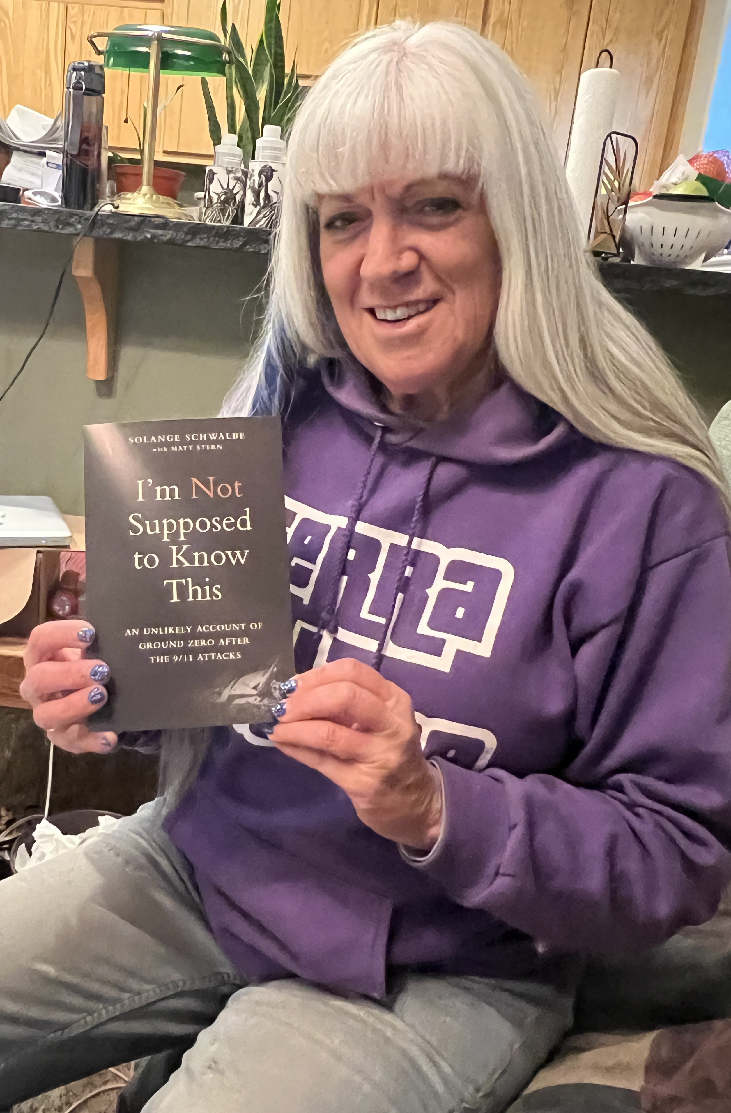 Solange Schwalbe holding a copy of "I'm Not Supposed to Know This".