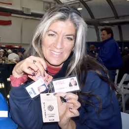 Solange Schwalbe holding credentials 
