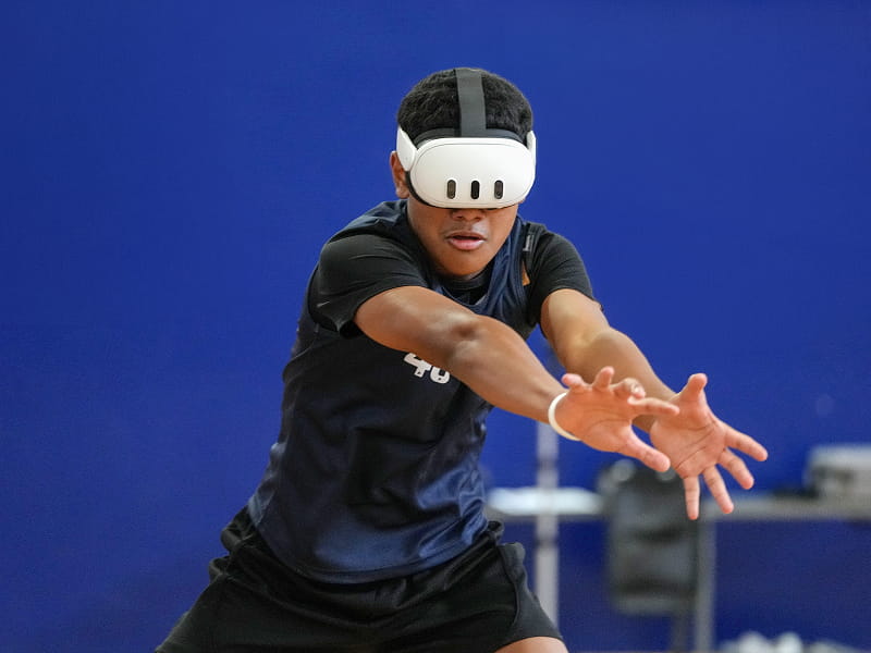 Athlete wearing VR headset during a reaction assessment