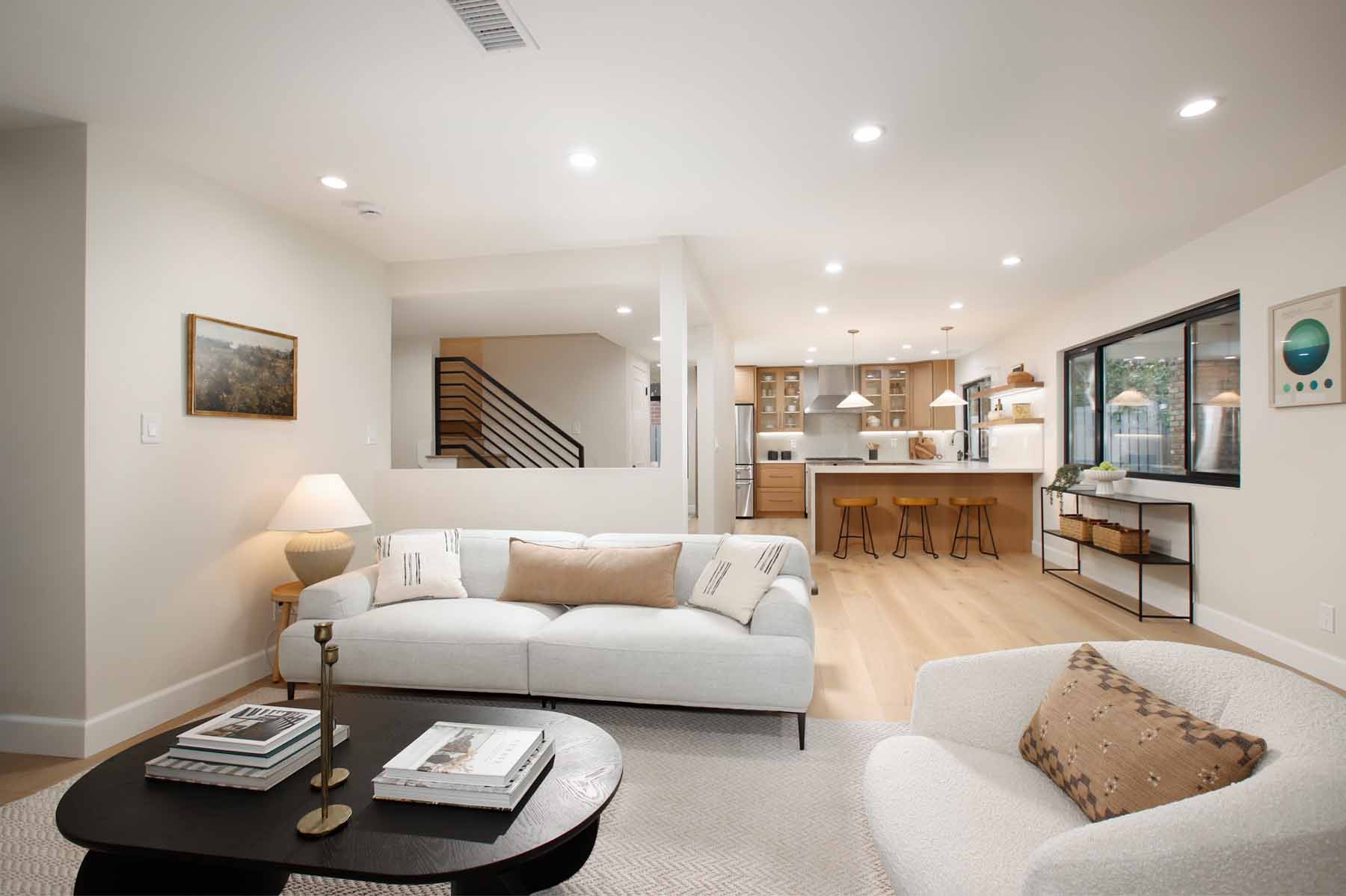 Living room looking toward the remodeled kitchen and staircase at 19939 Hemmingway Street, Winnetka
