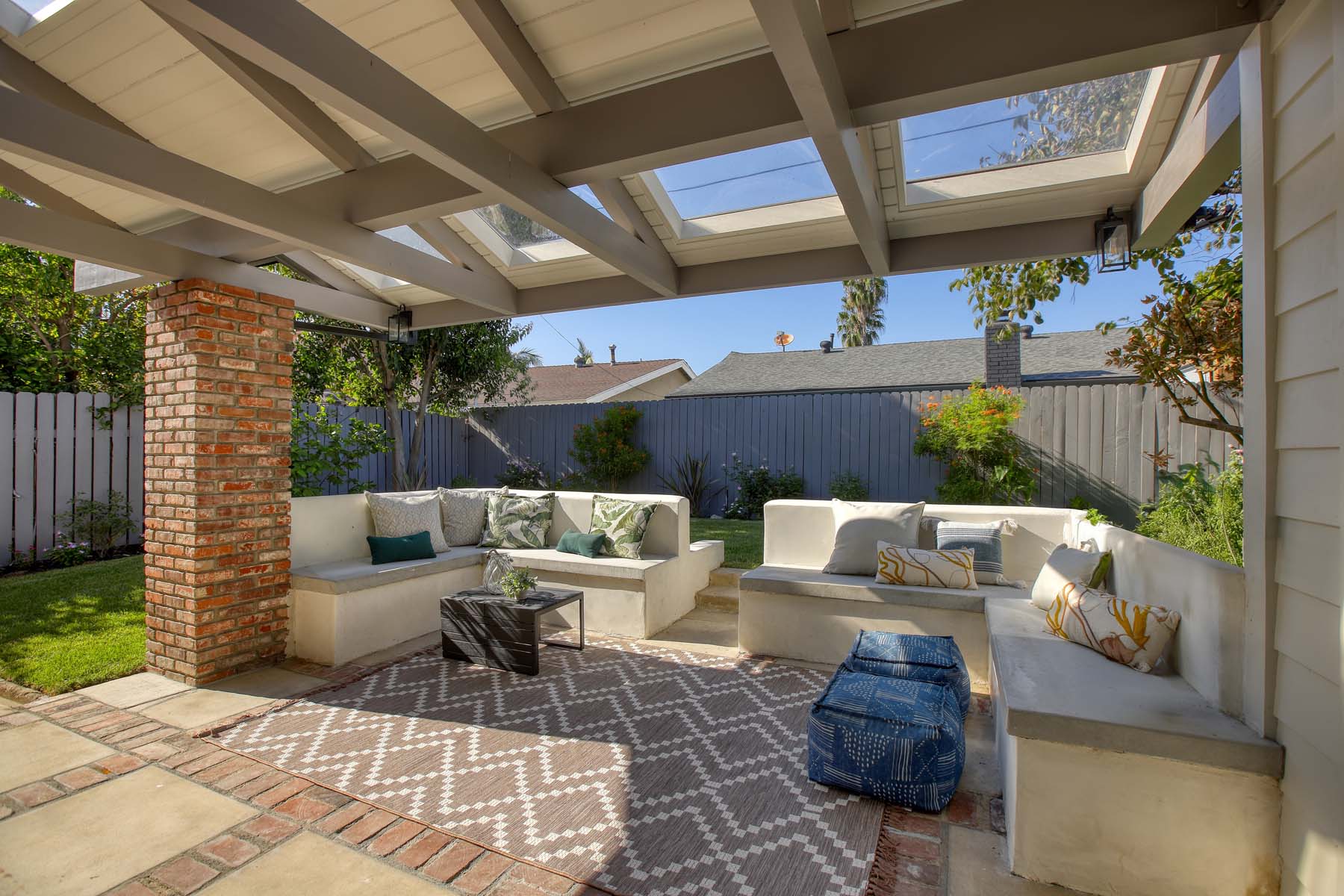 Covered patio with built-in bench seating and skylights at 19939 Hemmingway Street, Winnetka