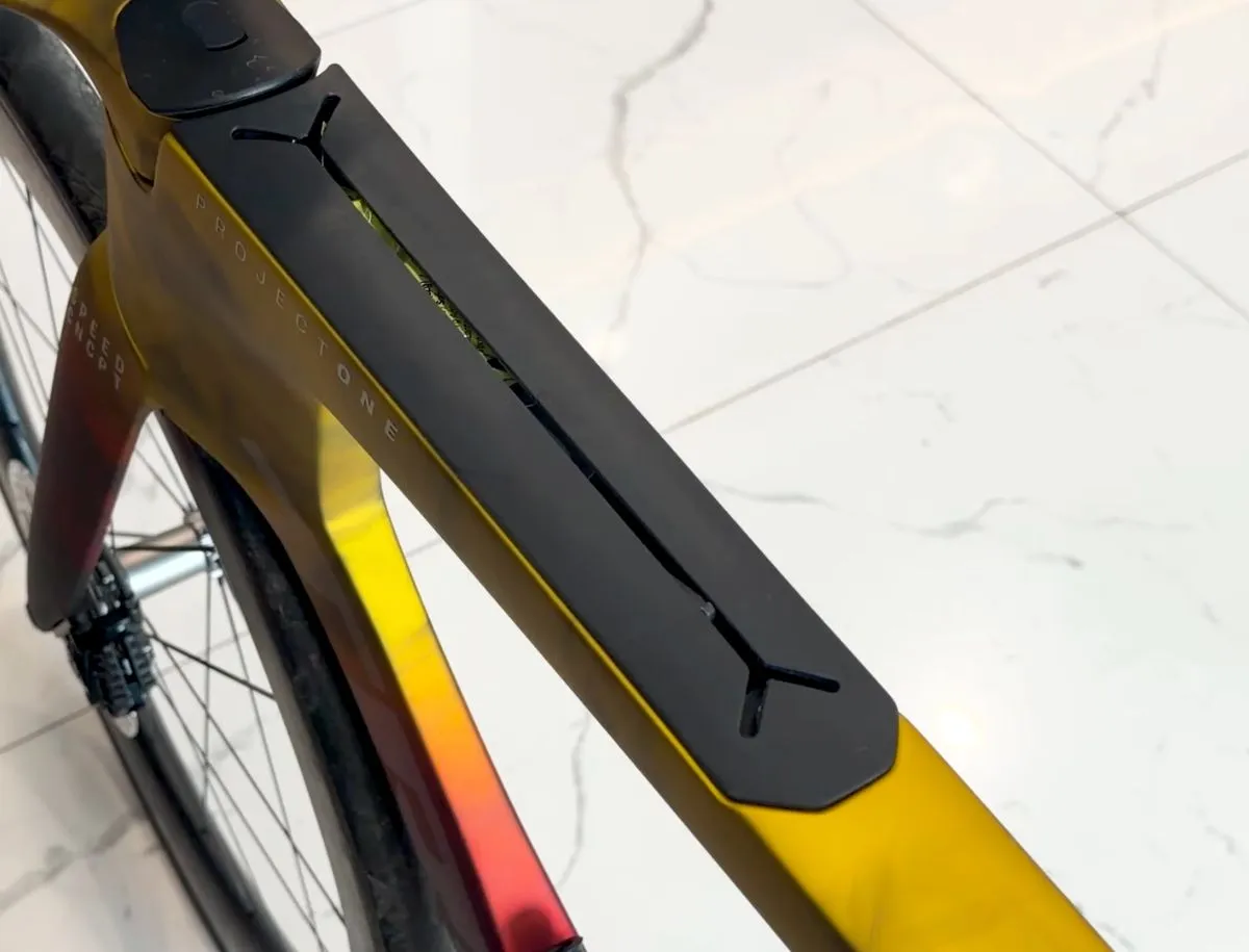 Trek Speed Concept SL7 downtube storage compartment open, showing internal frame storage box for triathlon essentials