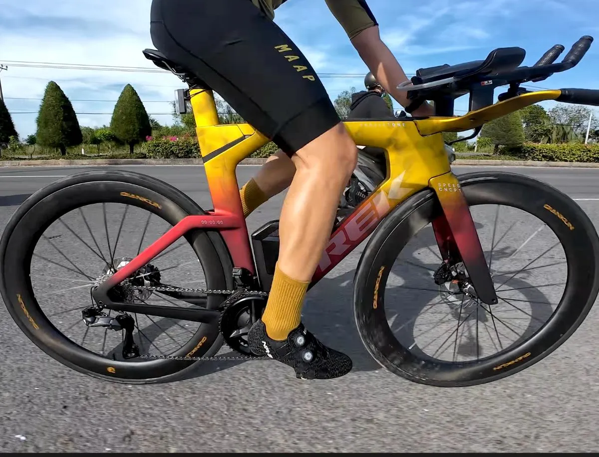 YOELEO QianKun CS60 60mm carbon wheels mounted on Trek Speed Concept triathlon bike with gold and red gradient Project One paint scheme during real-world road test
