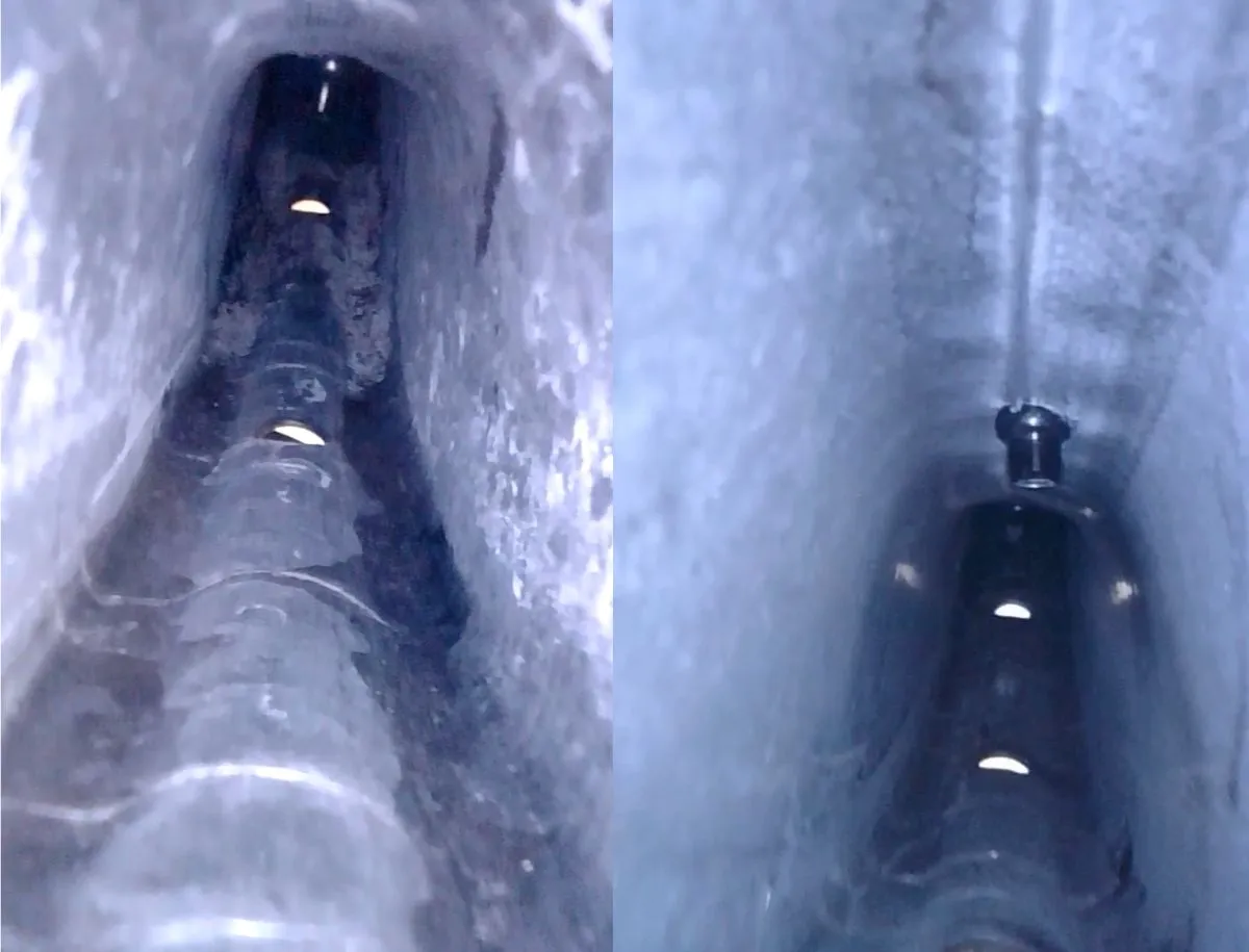 Endoscope camera view inside the Elitewheels ENT 2.0 rim showing carbon fiber layup texture with visible resin buildup and debris near the spoke nipple