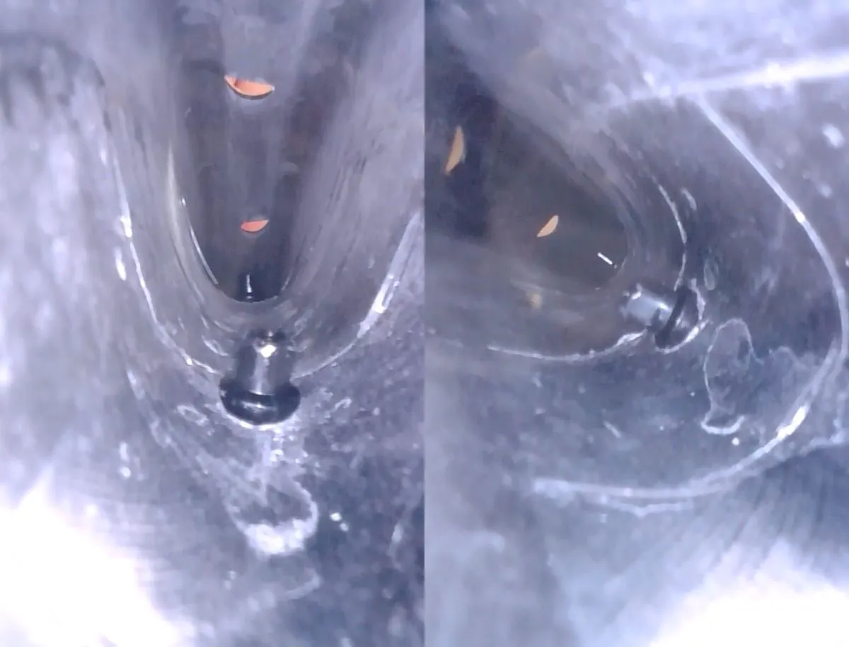 Endoscope camera view inside the ICAN AERO 50 II rim showing a smoother carbon fiber layup finish with a visible seam line near the spoke nipple