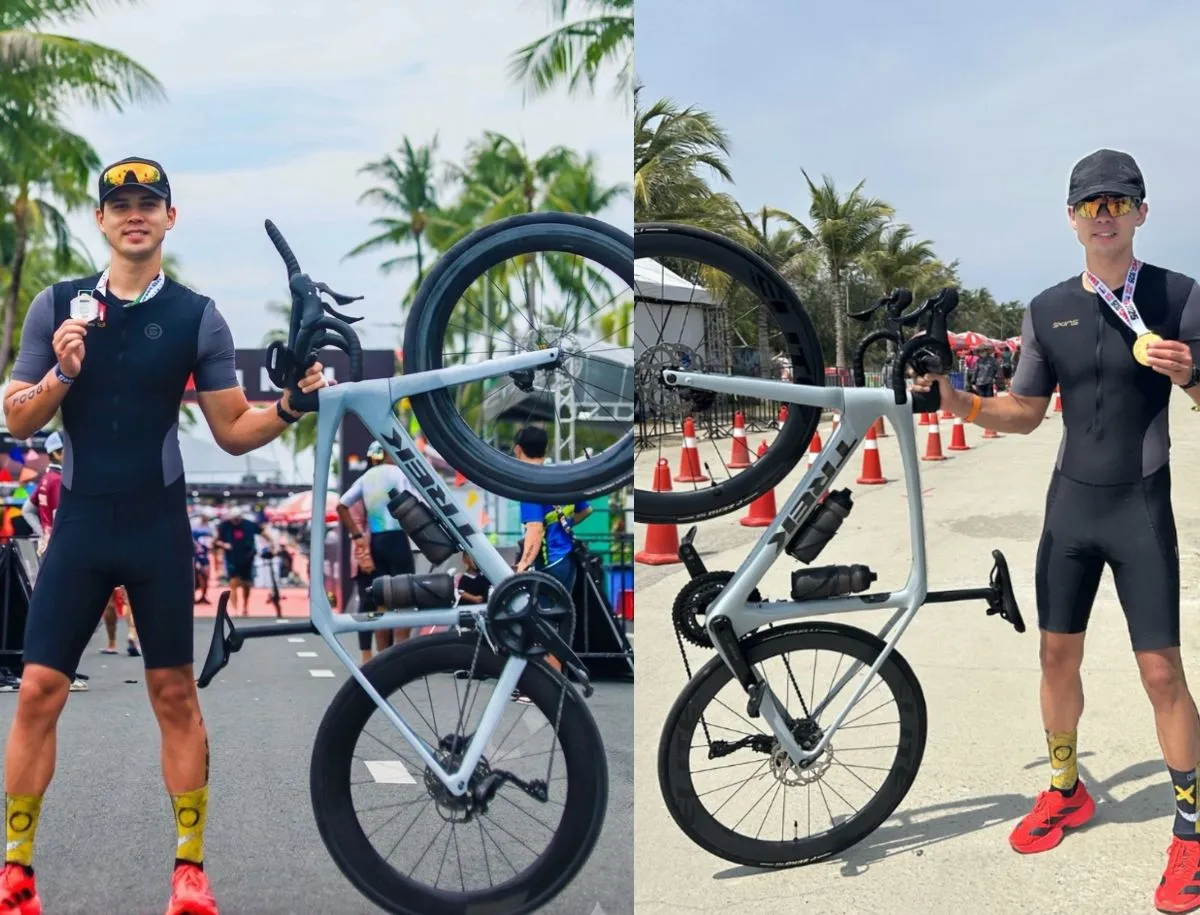 Mike Dee from BikeLabHQ holding finisher medals at two Ironman 70.3 events alongside Trek Domane SL5 in Plasma Grey Pearl with Elitewheels carbon wheels and aerobars