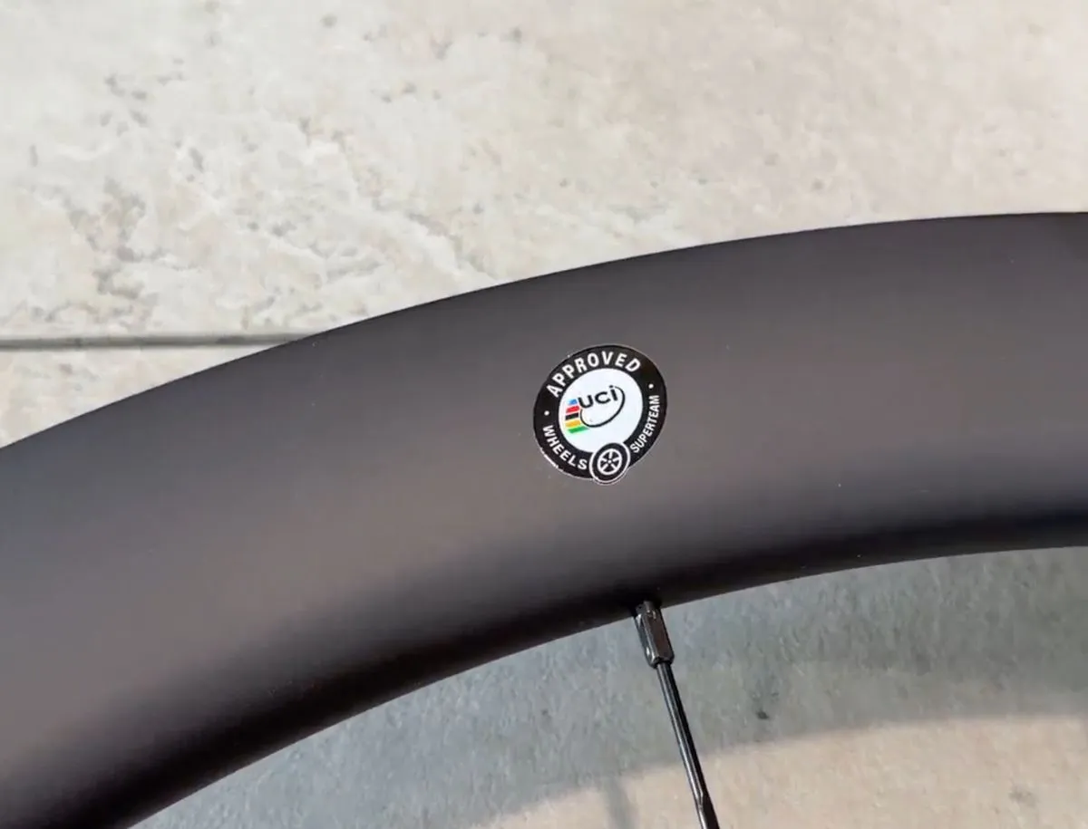 Close-up of the UCI approved wheels sticker on the Superteam Classic Pro carbon rim