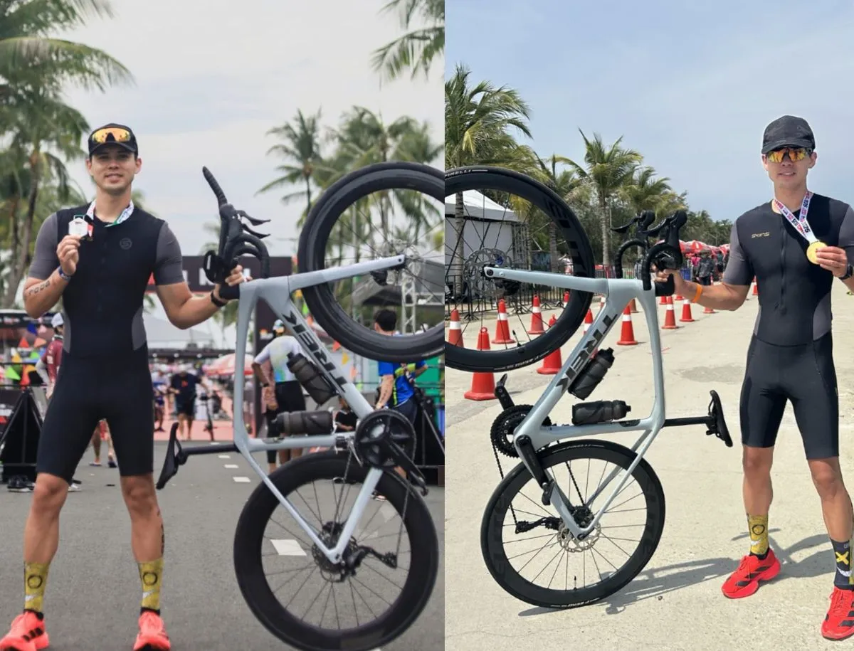 Mike Dee at a triathlon finish line with medals, part of two years and over 7,000 kilometers of Ironman 70.3 training documented for the Elitewheels ENT 2.0 durability test.