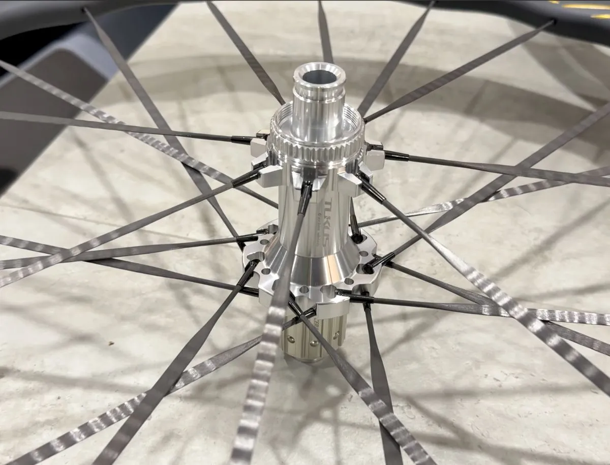 Close-up of TUKUS GA25 hub on Bluefin Turbo SR wheel showing spoke lacing pattern
