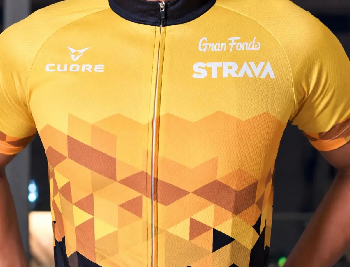 Yellow and black Cuore Strava Gran Fondo cycling jersey close-up