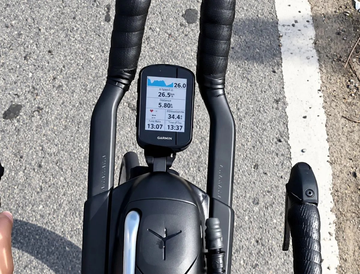 Garmin Edge 840 bike computer mounted on a road bike cockpit displaying ride data