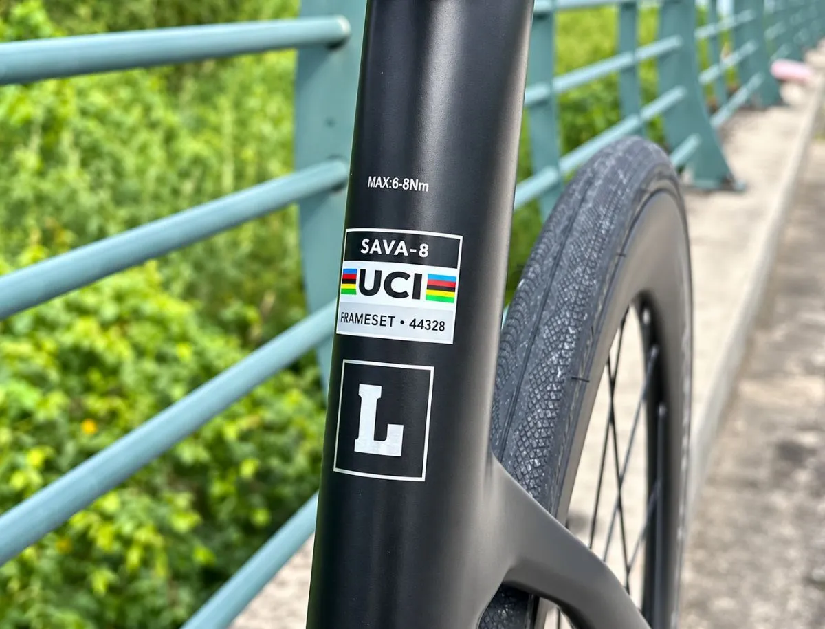 UCI approval label displayed on the carbon frame of the SAVA A7L Pro road bike.