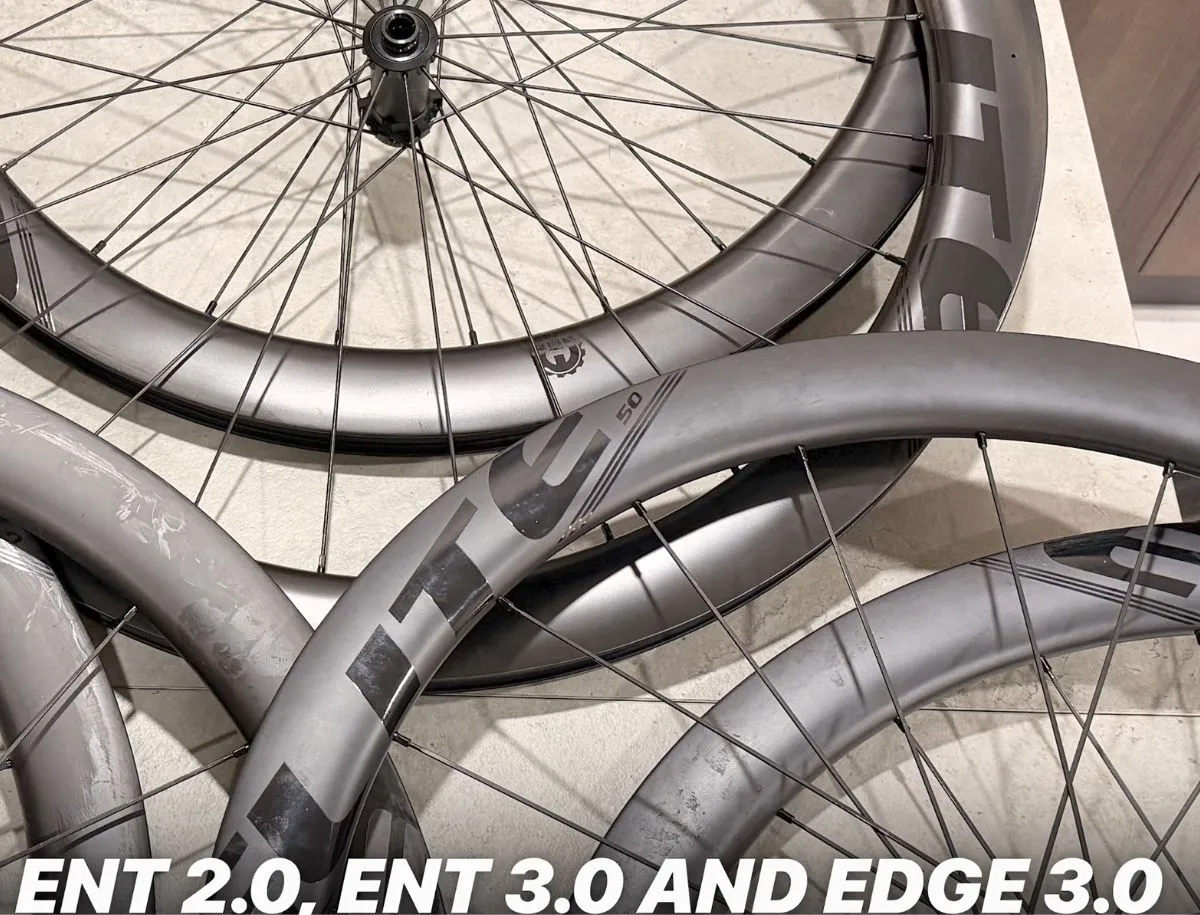 Elitewheels ENT 2.0, ENT 3.0 and EDGE 3.0 carbon wheelsets photographed together to compare their rim finishes and designs.